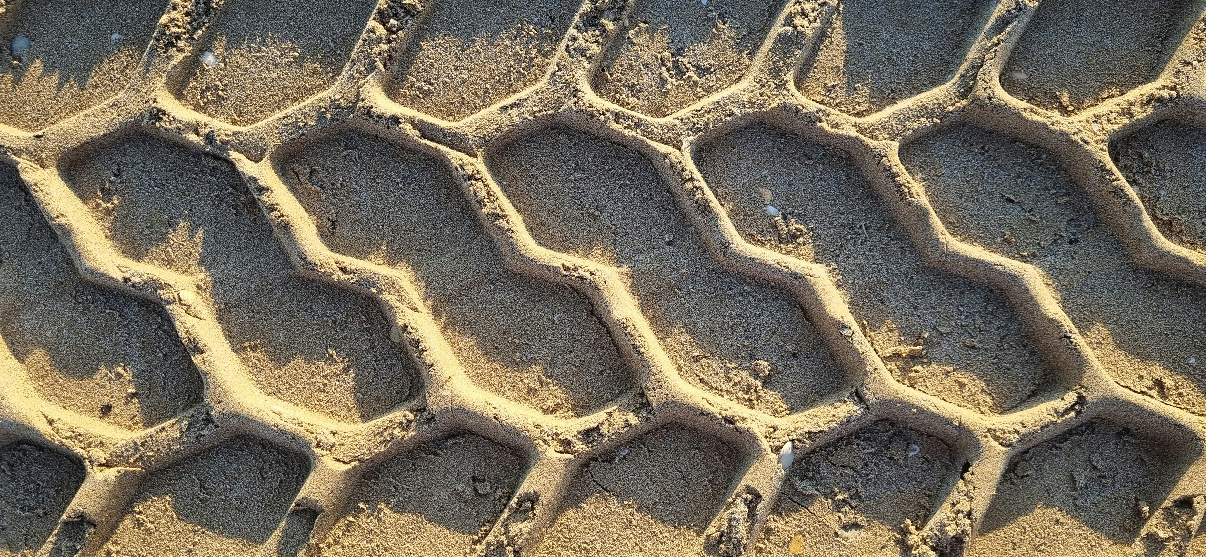 Tire track imprint in the sand