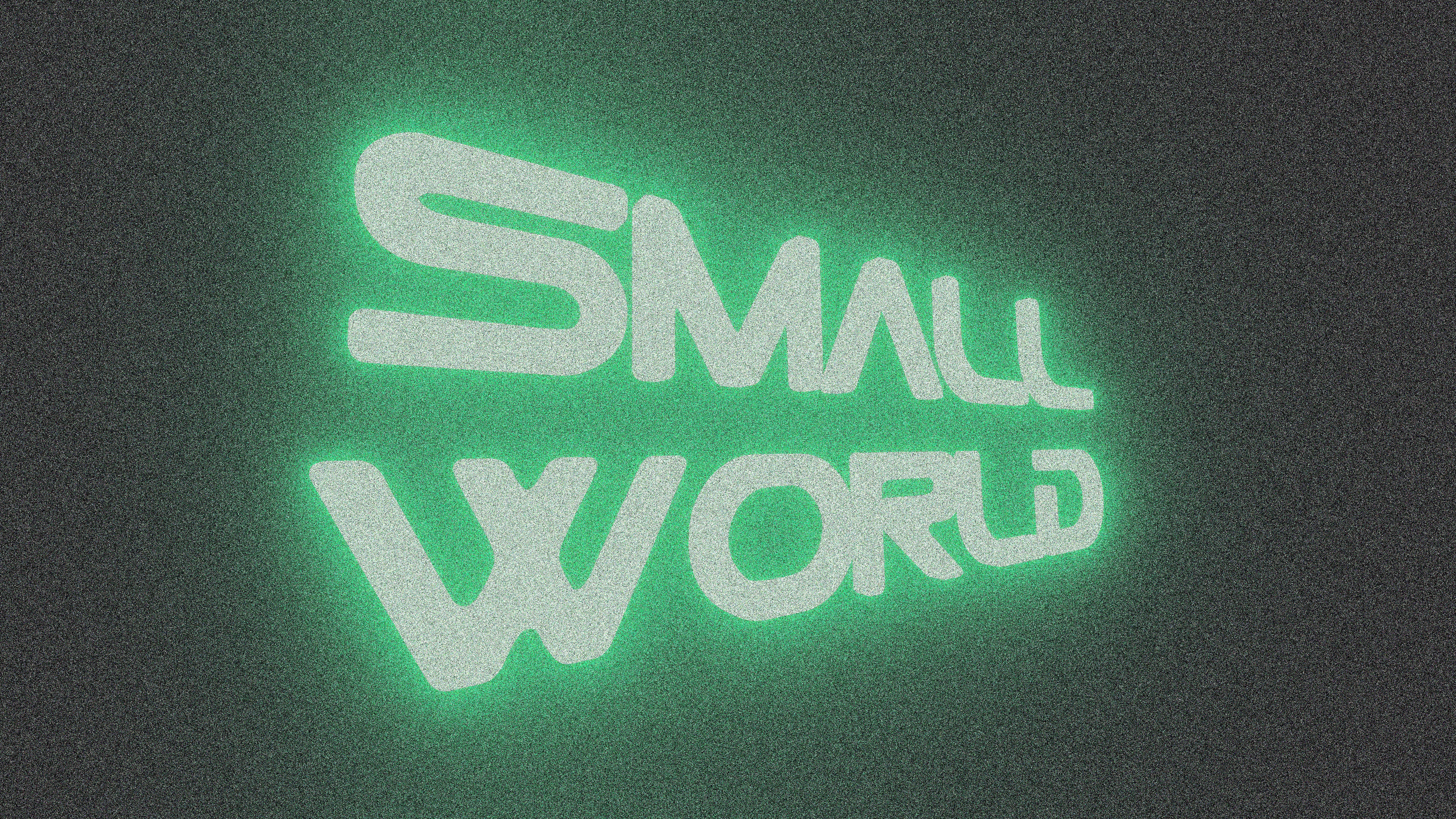 Green neon text reads small world