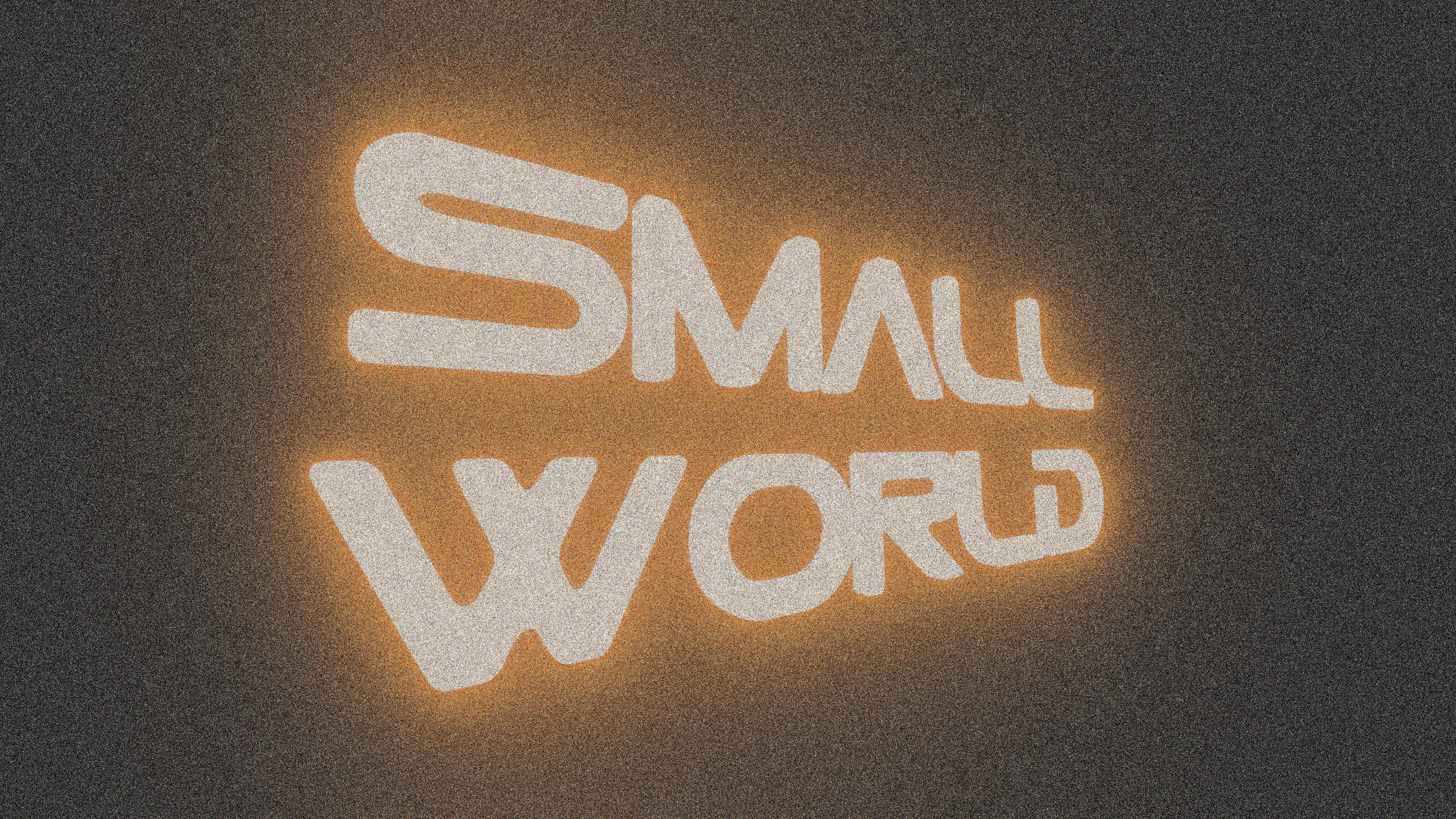Glowing "small world" text on a textured background.