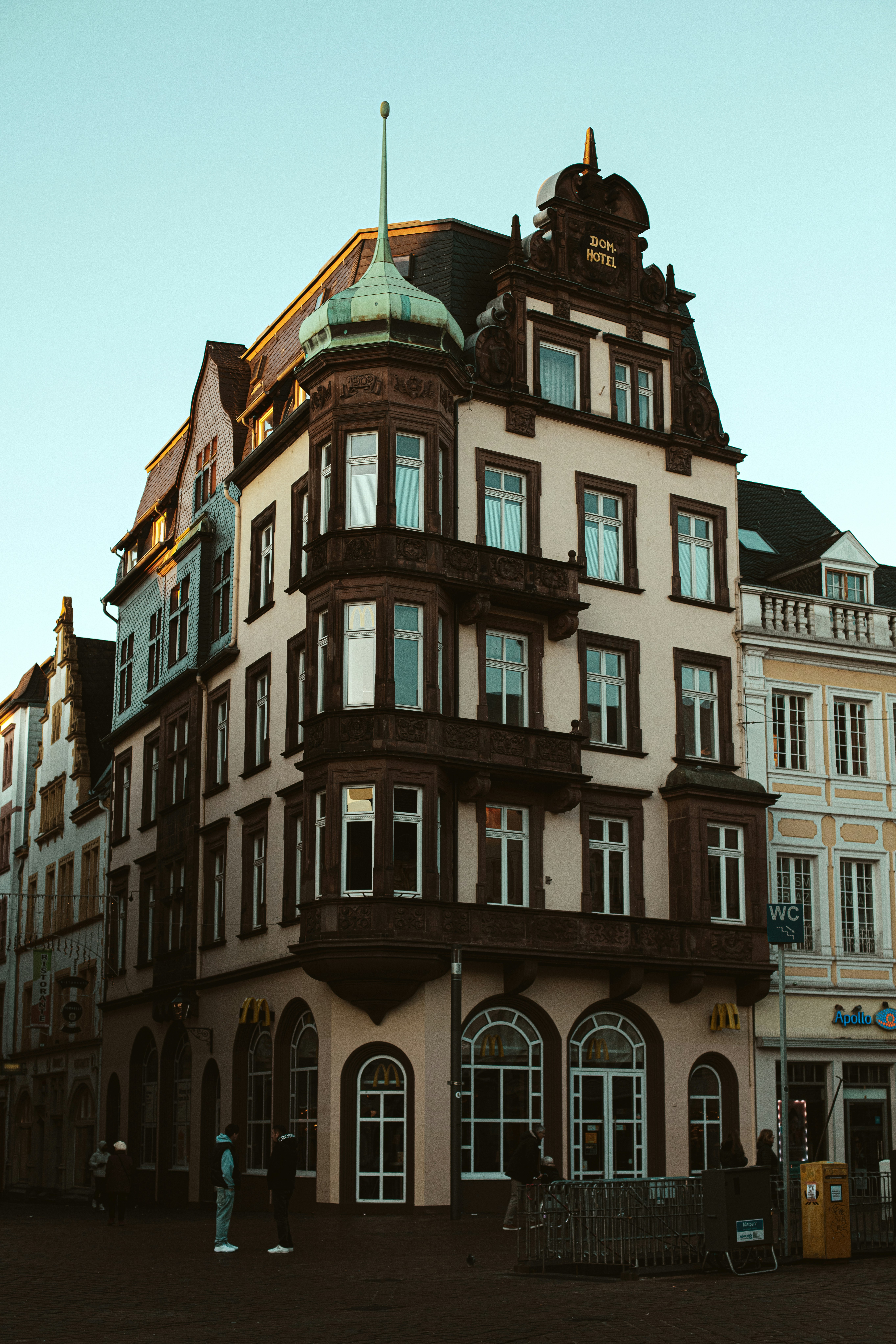 Ornate building with bay windows under clear sky