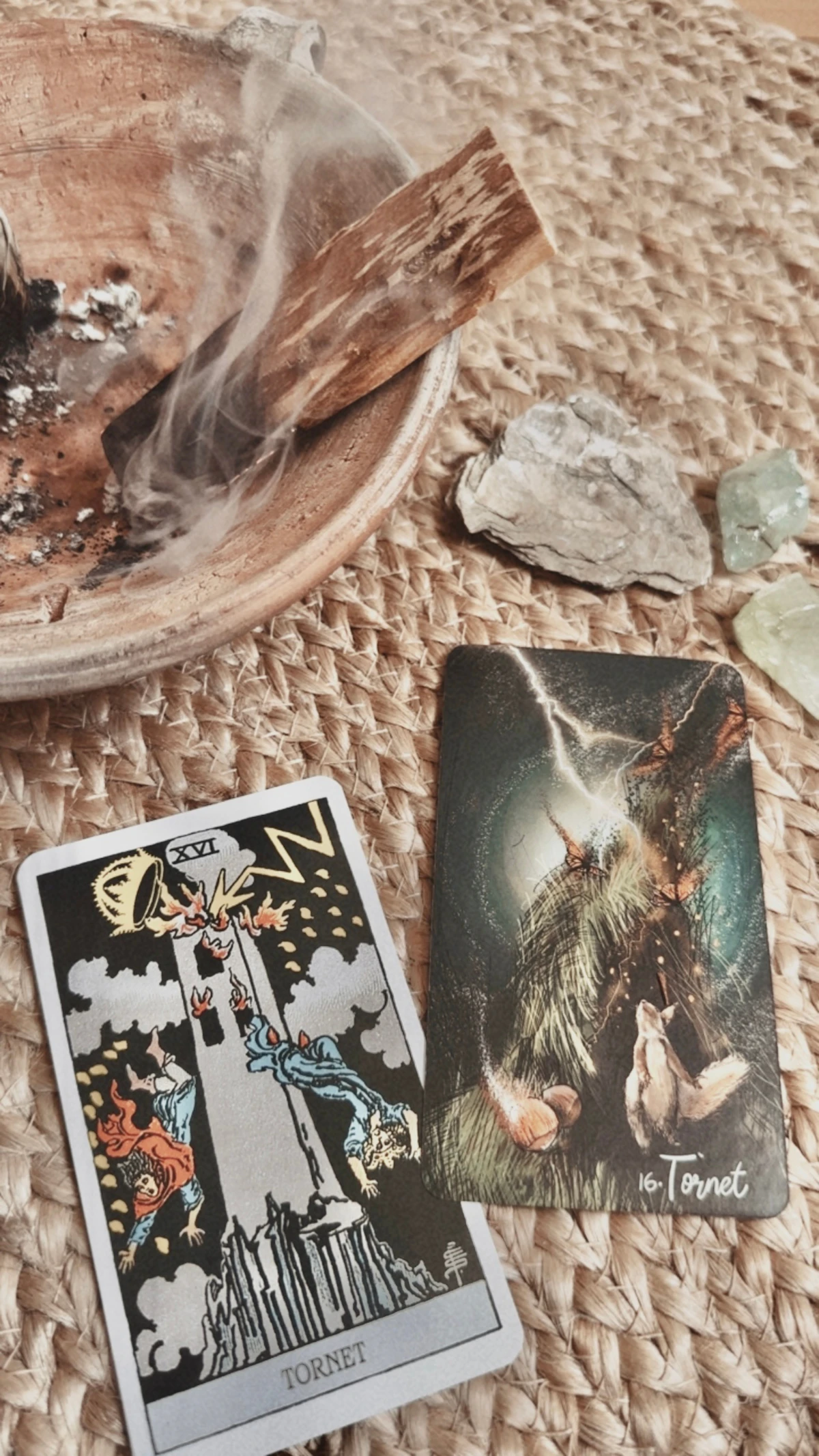 Burning palo santo with tarot cards and crystals