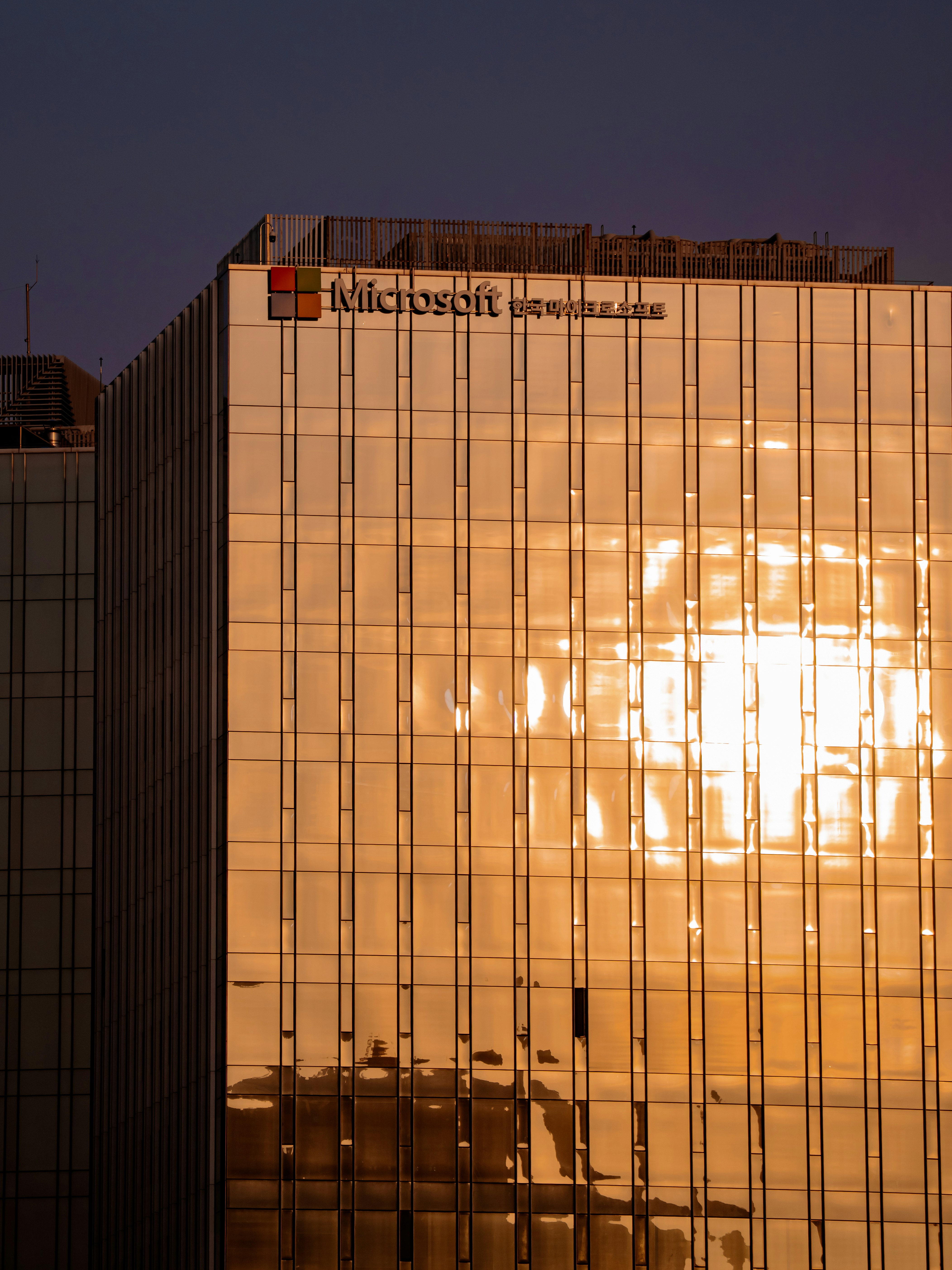 Microsoft building exterior with golden sunset reflections