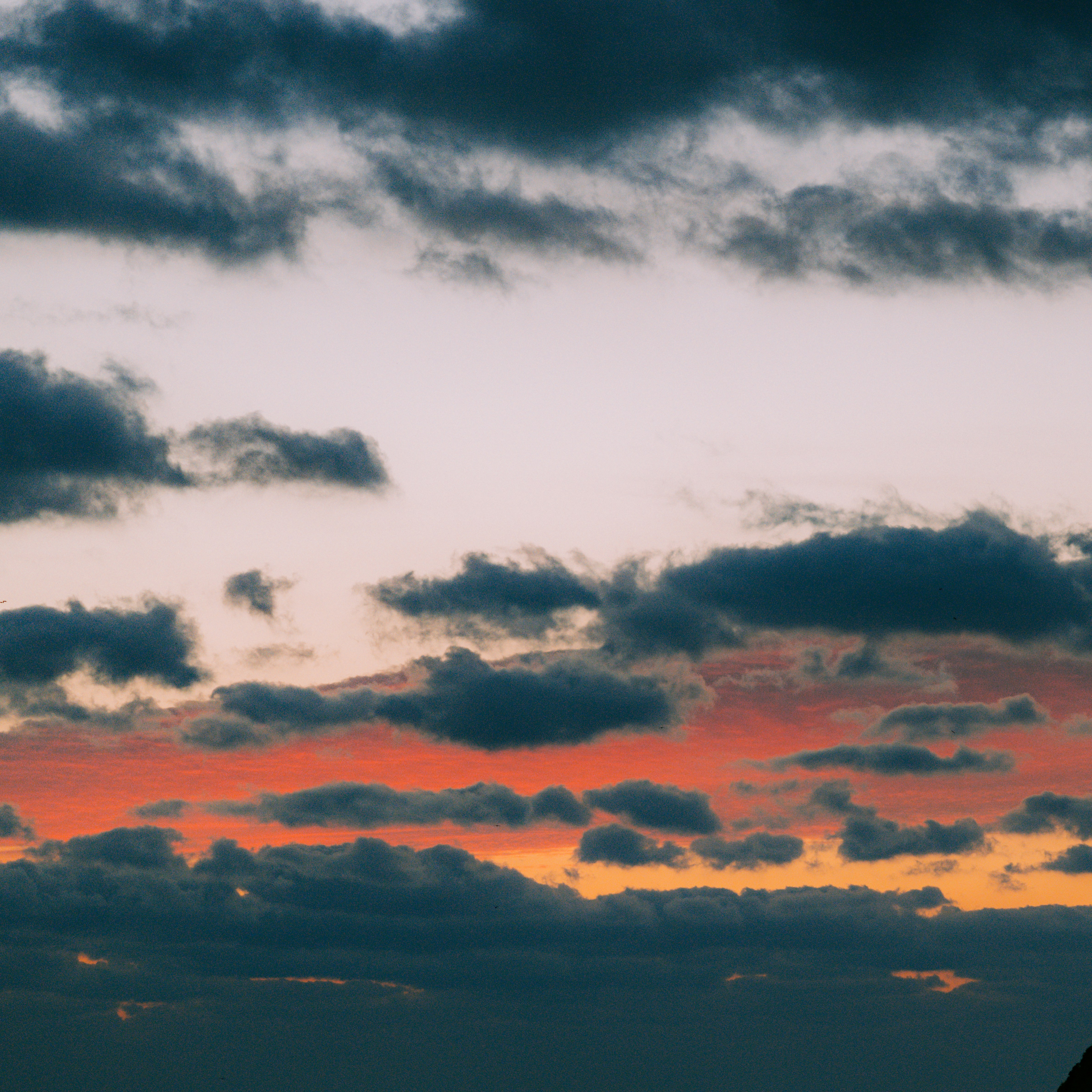 Dramatic clouds at sunset with orange glow