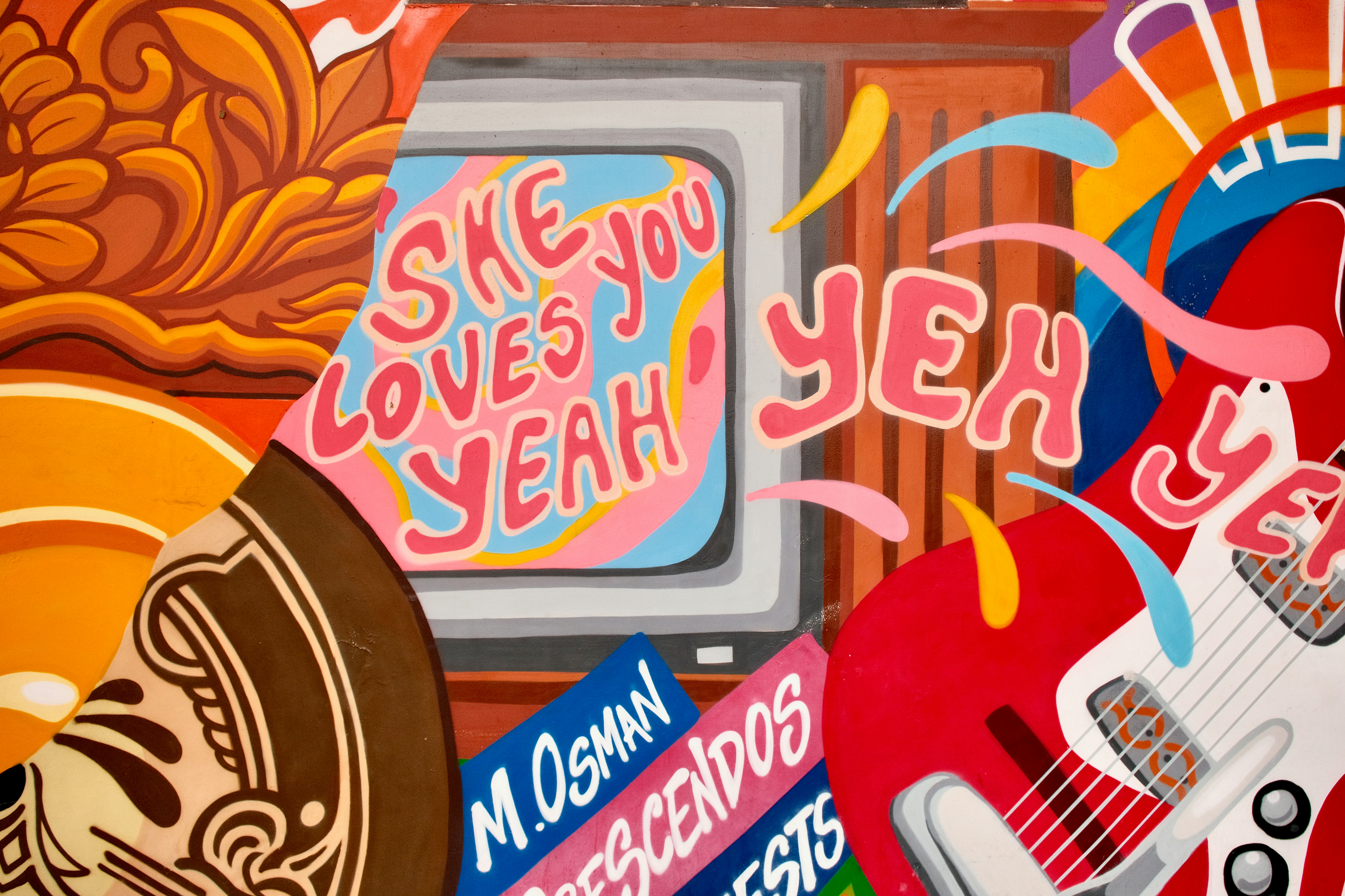 テキストとギターを使った鮮やかなサイケデリックアート。