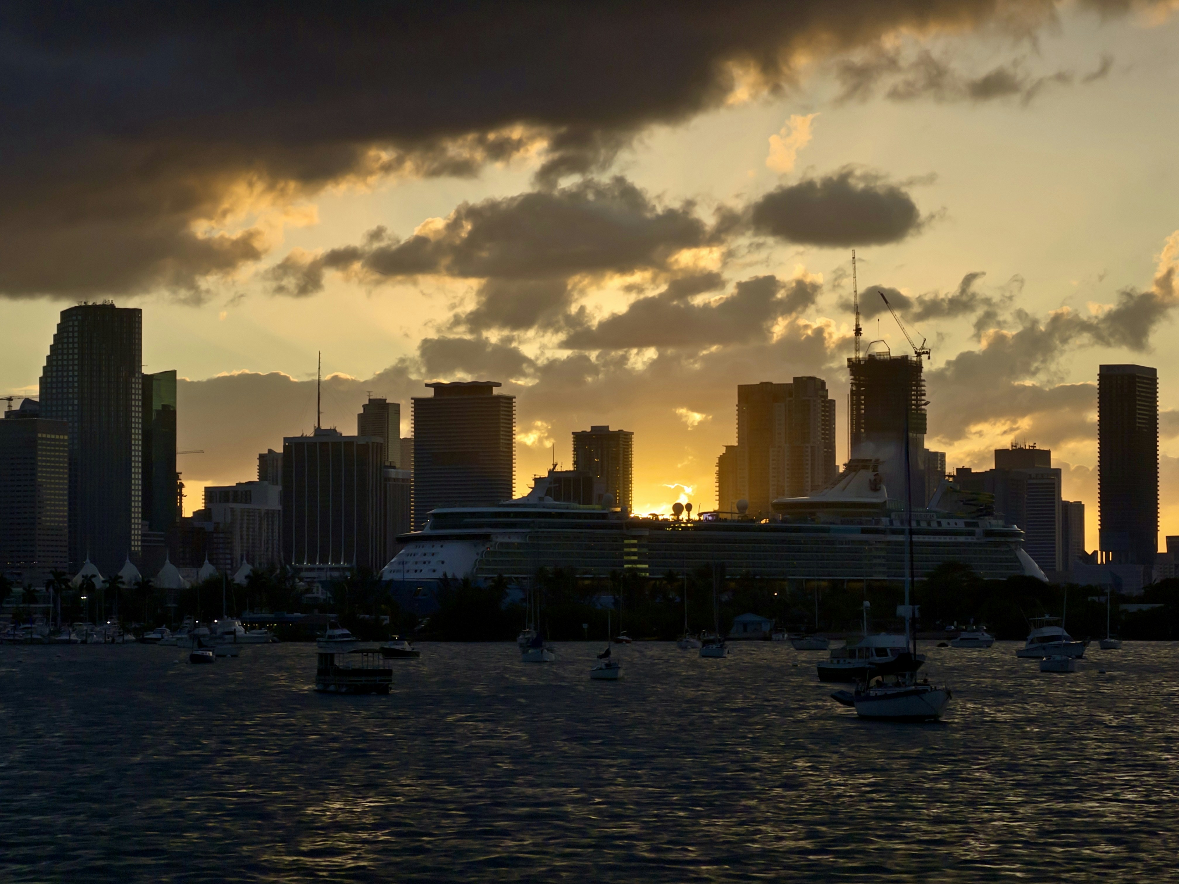 The stunning Miami skyline at sunset highlighting luxury high-rises - miami golf sim apartments