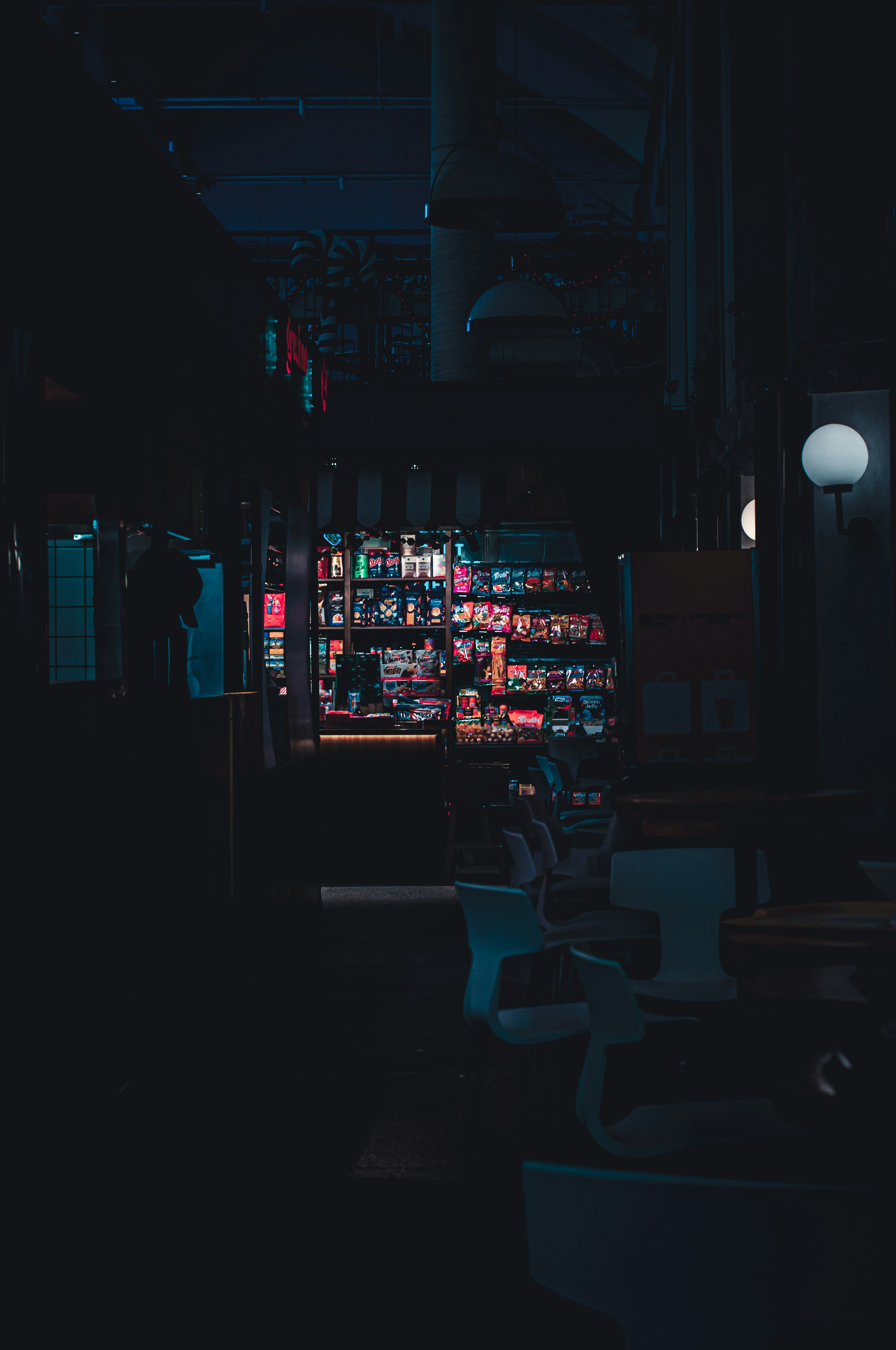 A brightly lit convenience store at night.