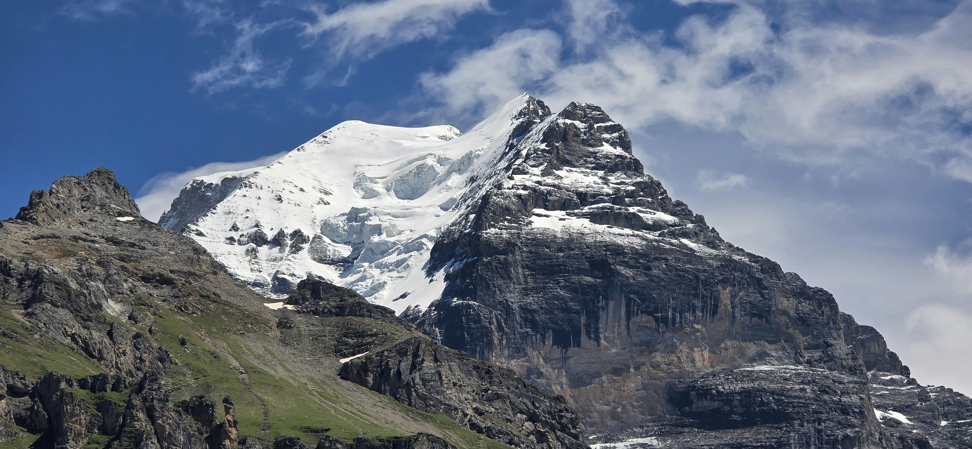 Snow-capped mountain peak under a blue sky