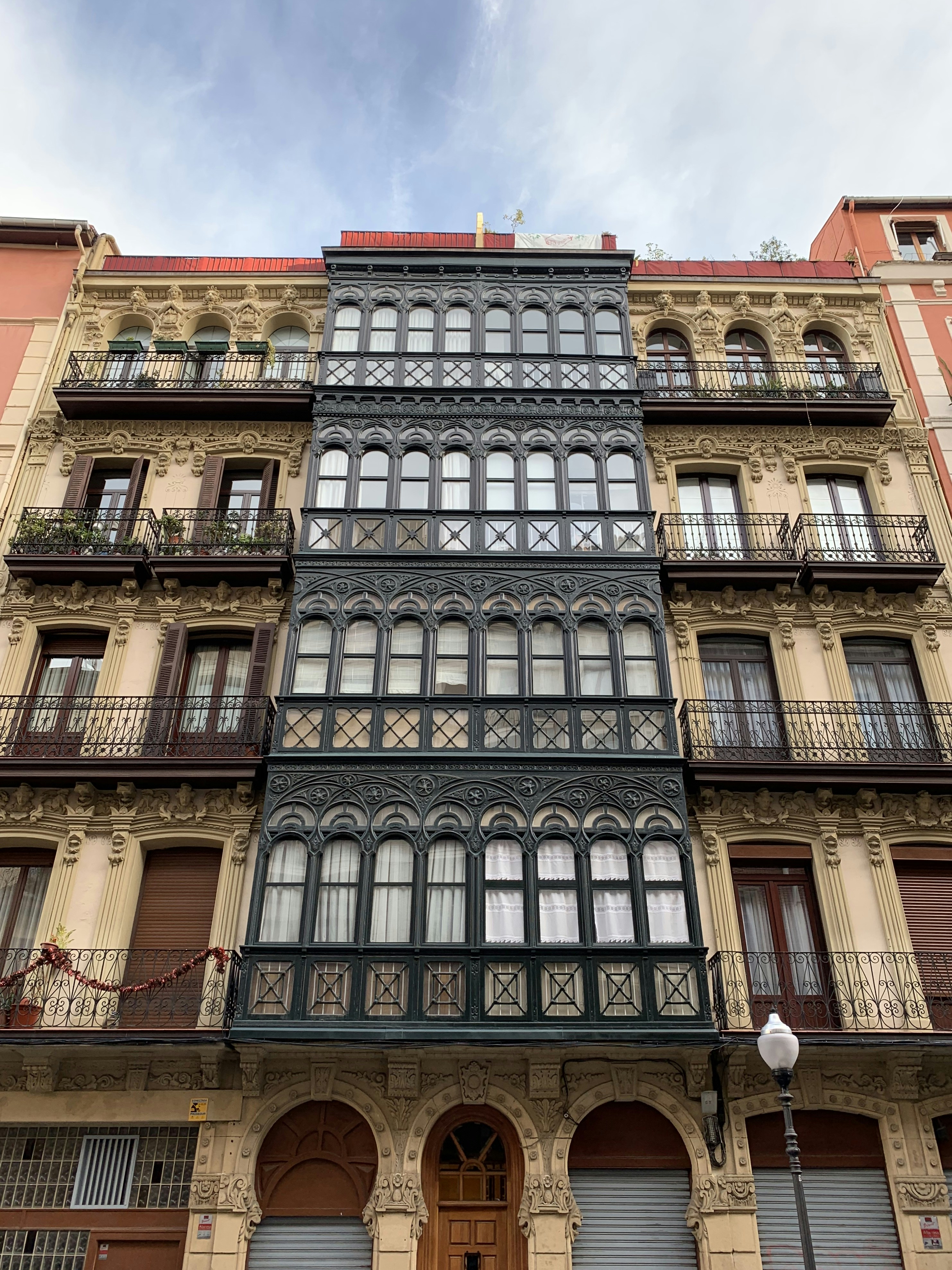 Ornate historic building facade with a large bay window.