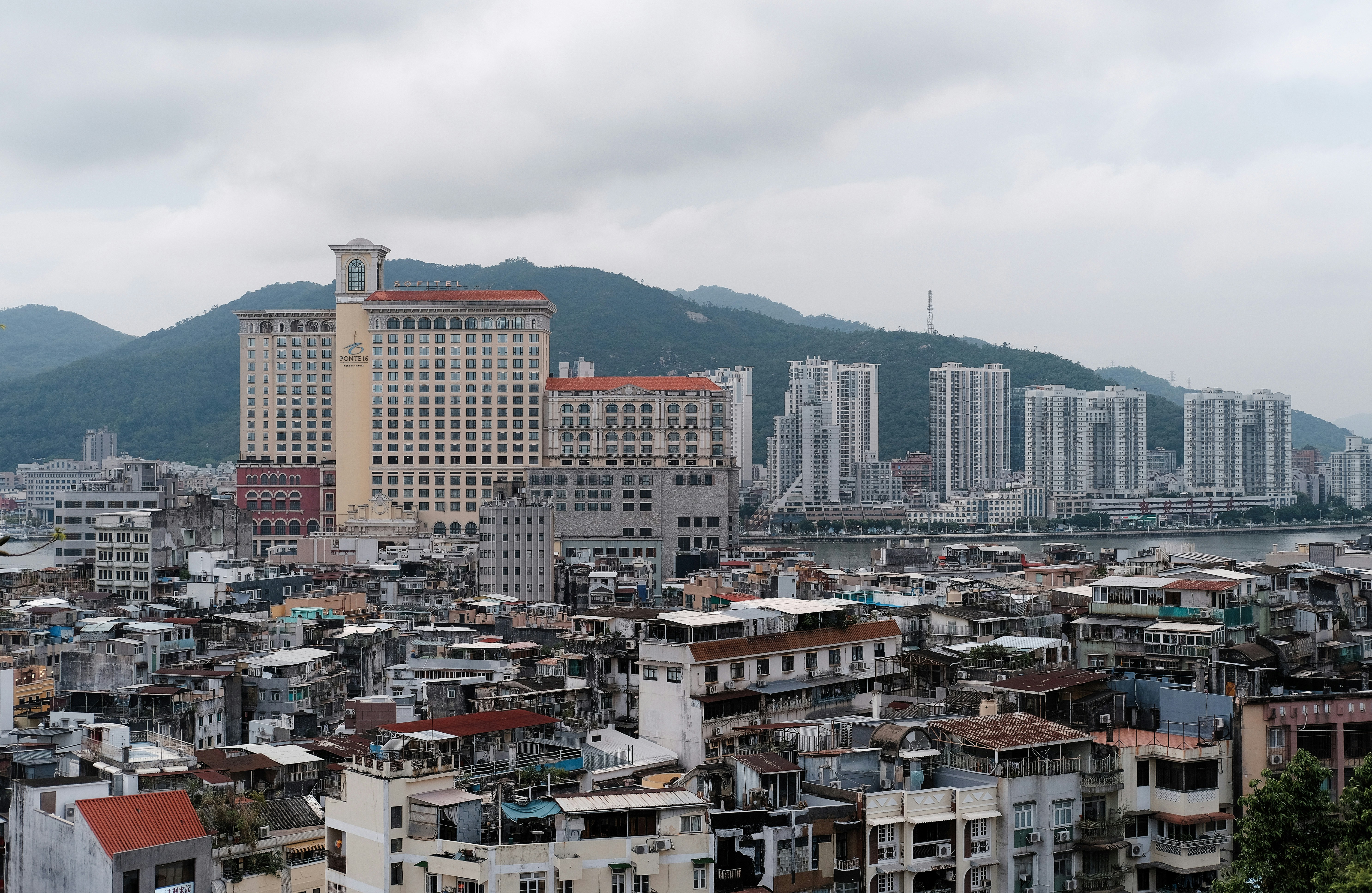 City buildings with mountains in the background