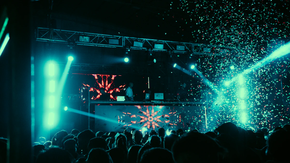 DJ and crowd beneath confetti and lights