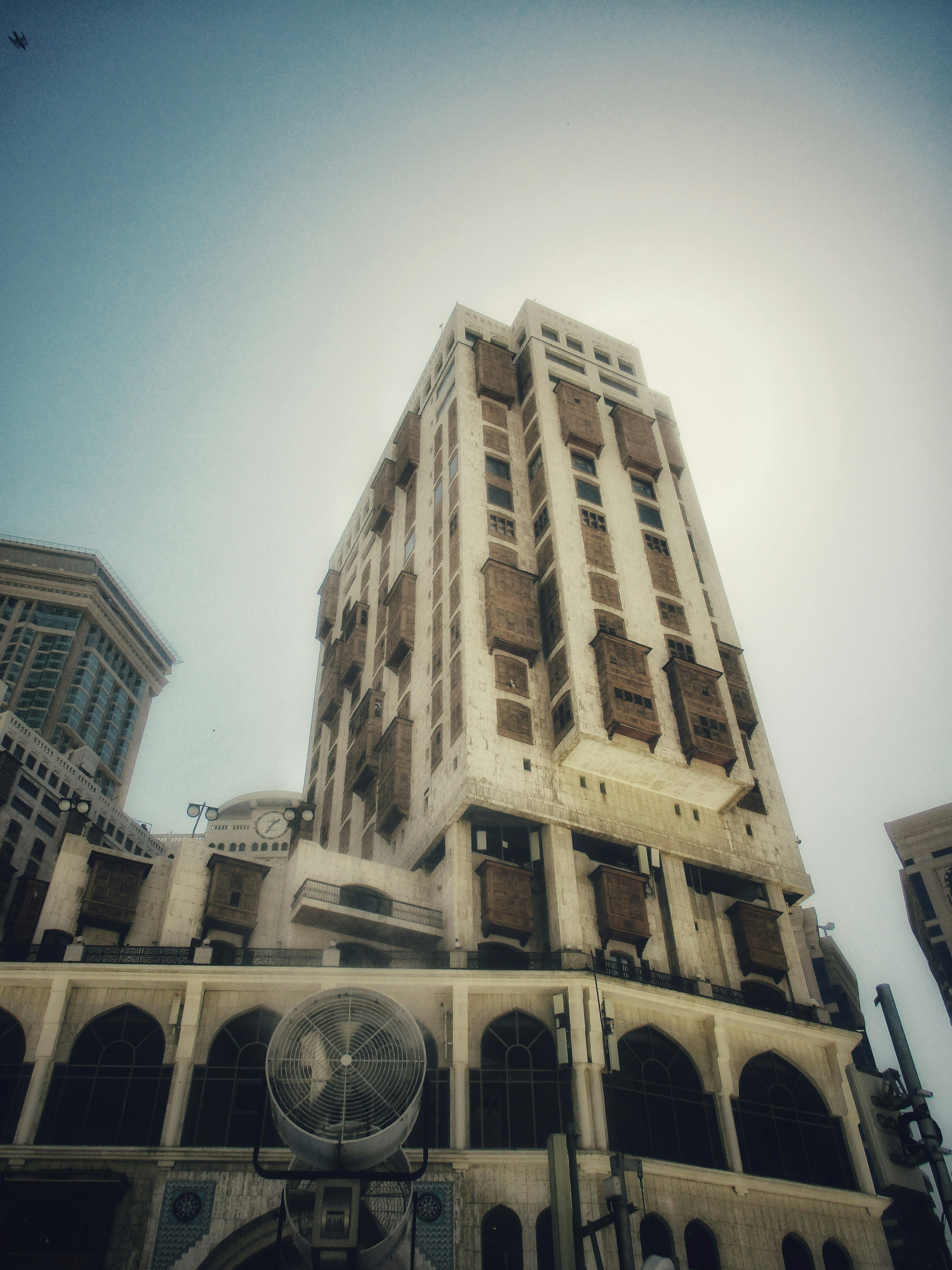 Tall modern building with ornate windows and arches