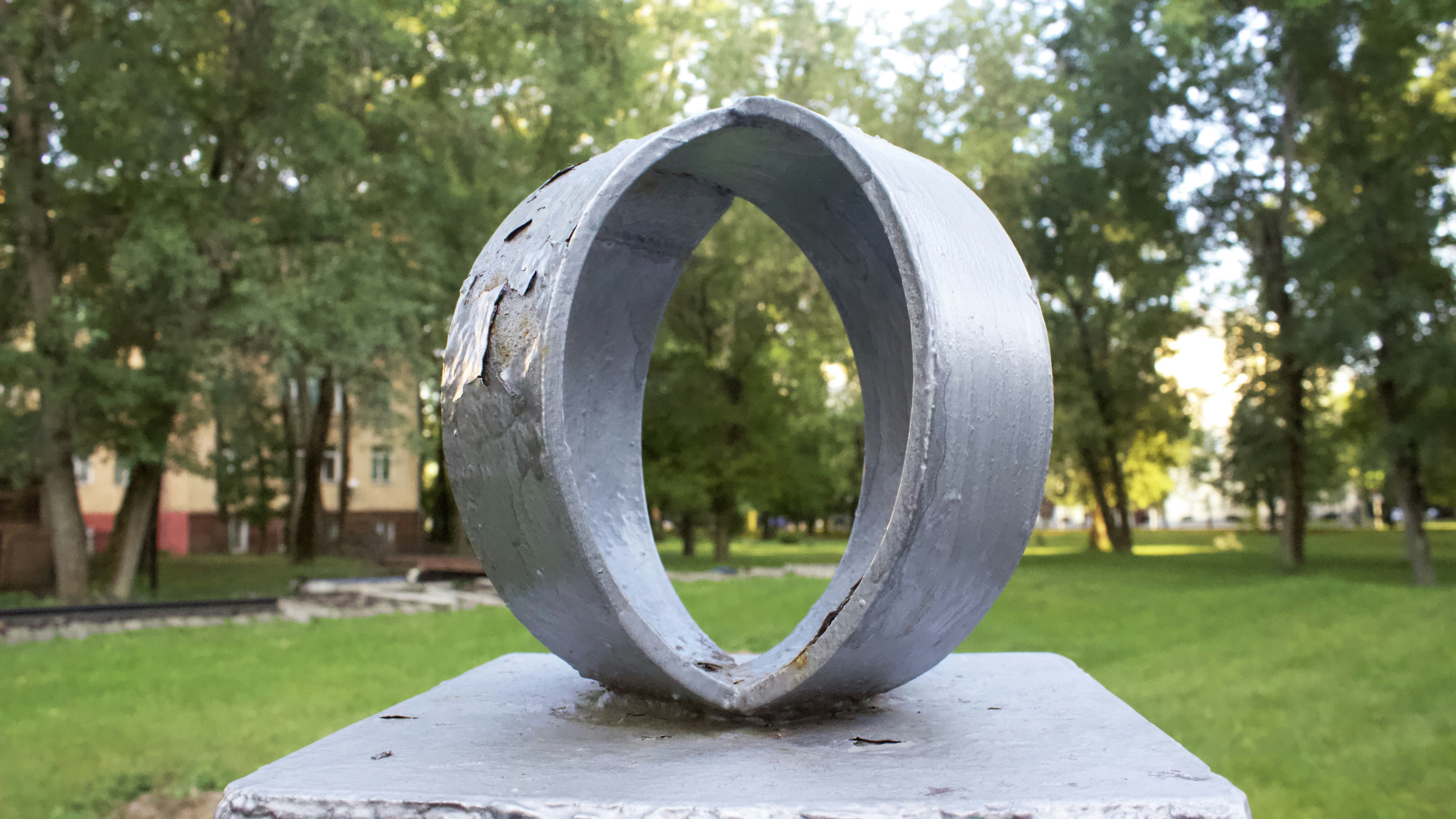 A metal sculpture in a park setting