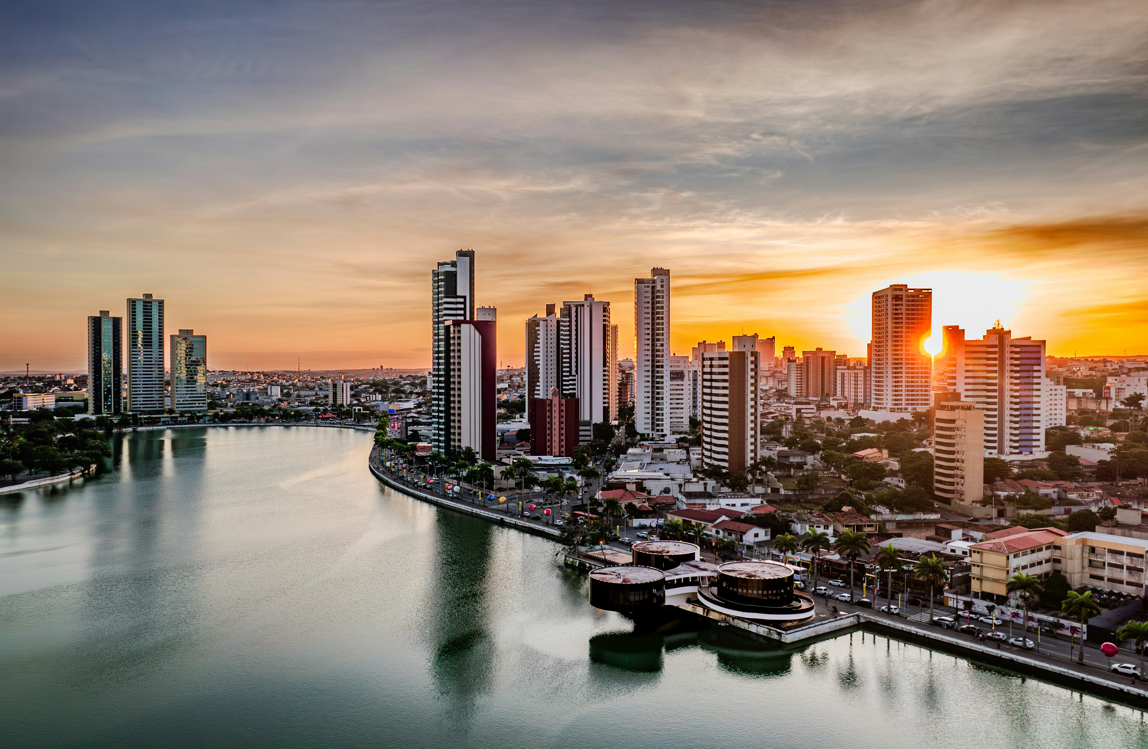 City skyline along a river at sunset