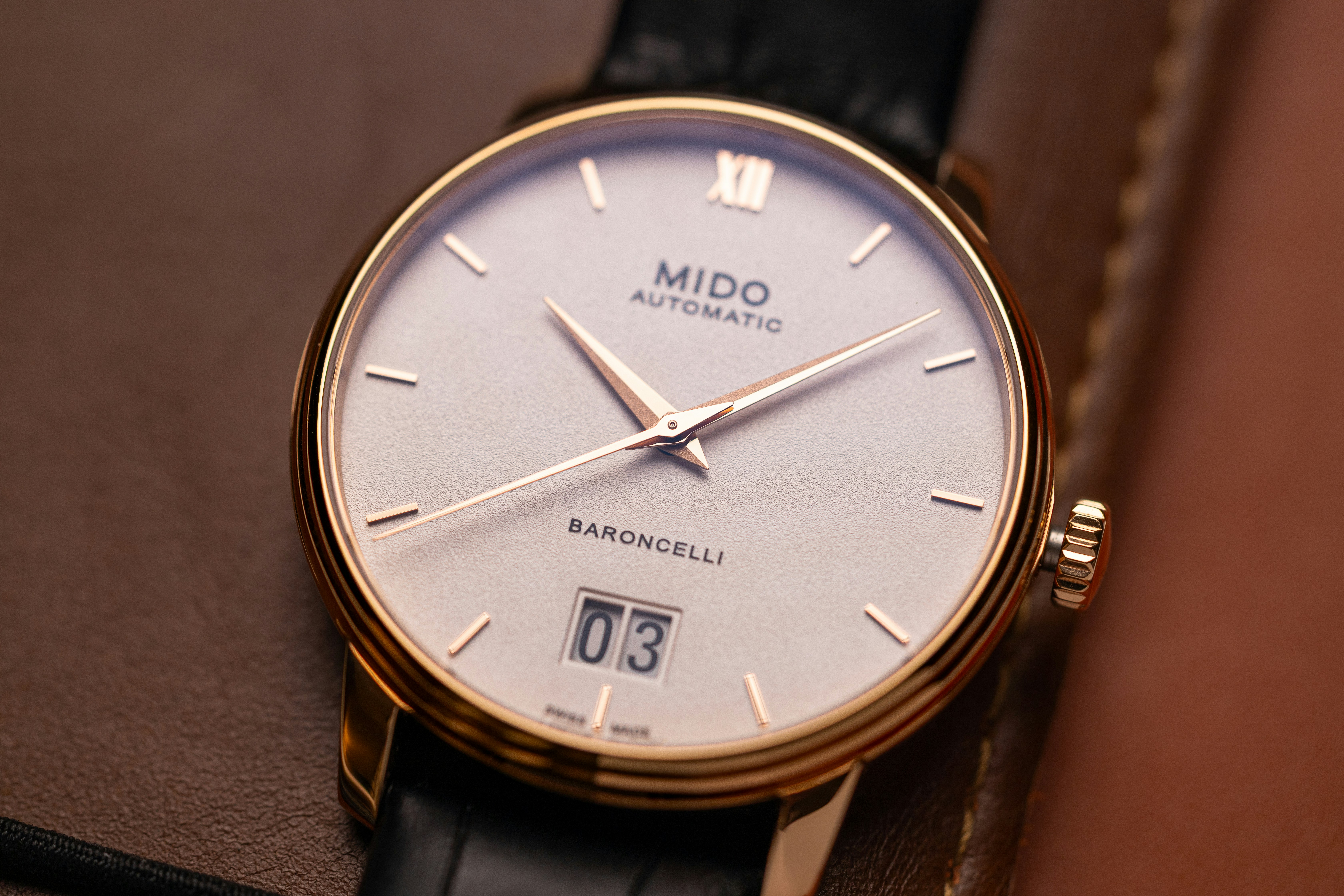 A close-up of a mido baroncelli automatic watch.