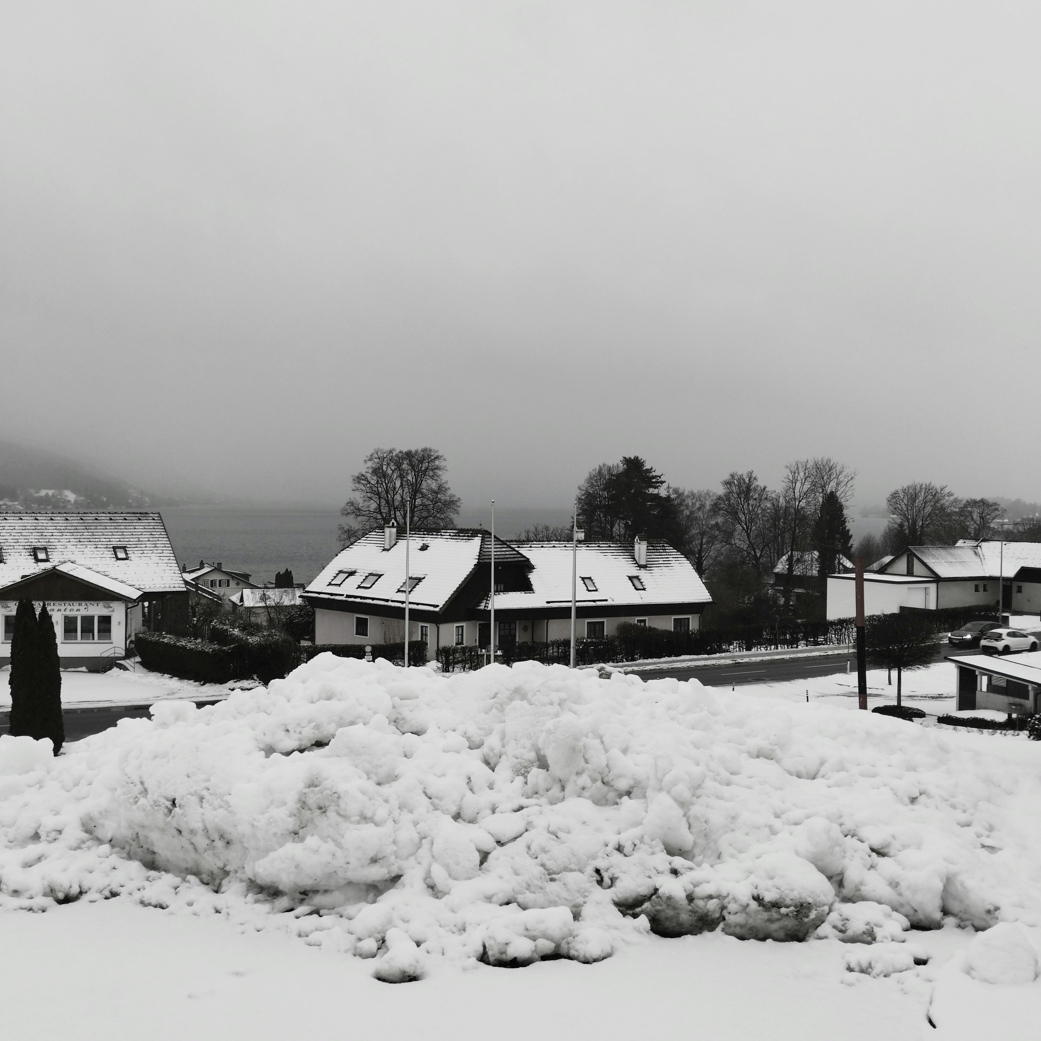 Snow-covered houses in a quiet village during winter
