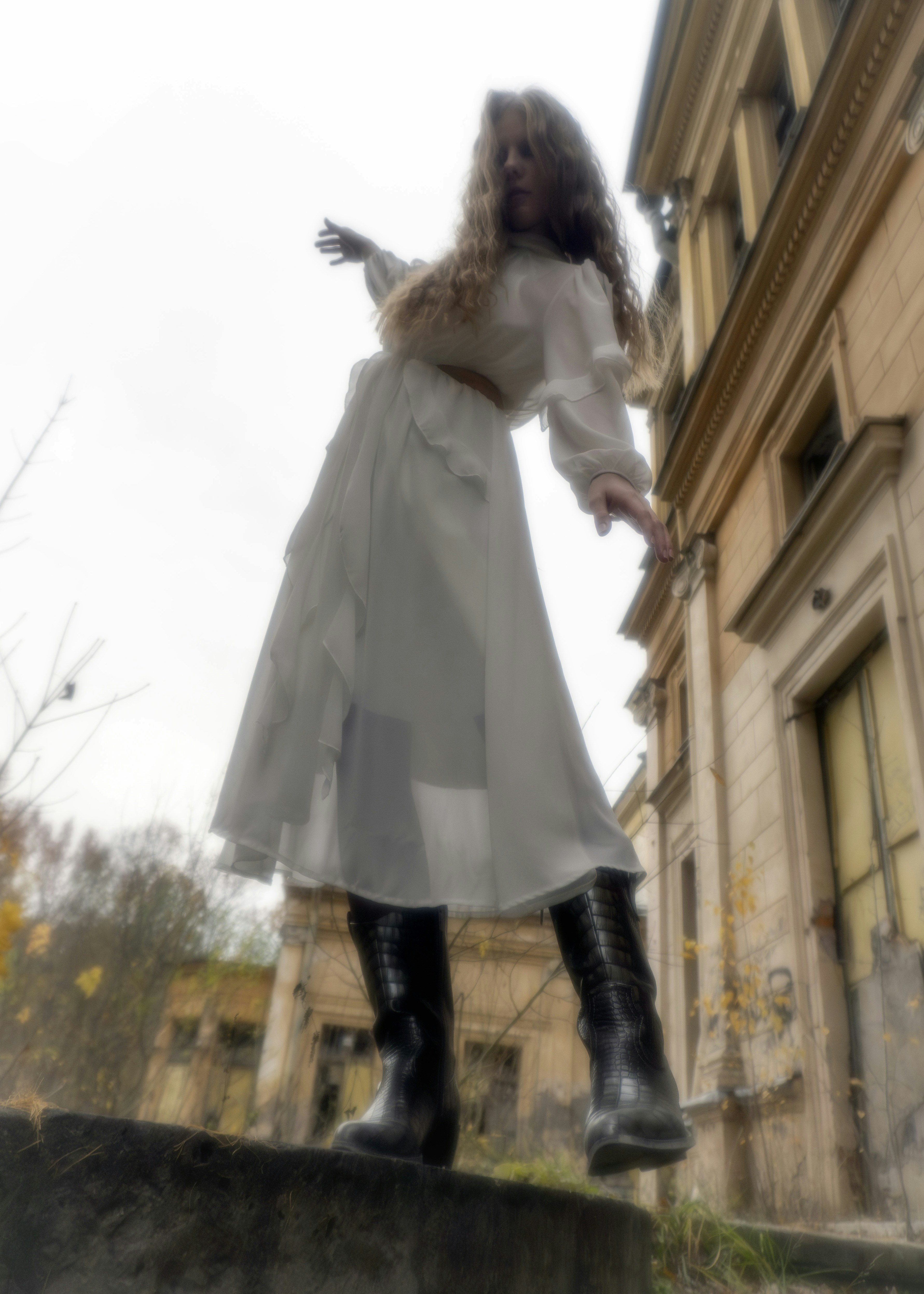 Beige coat twirl, back view