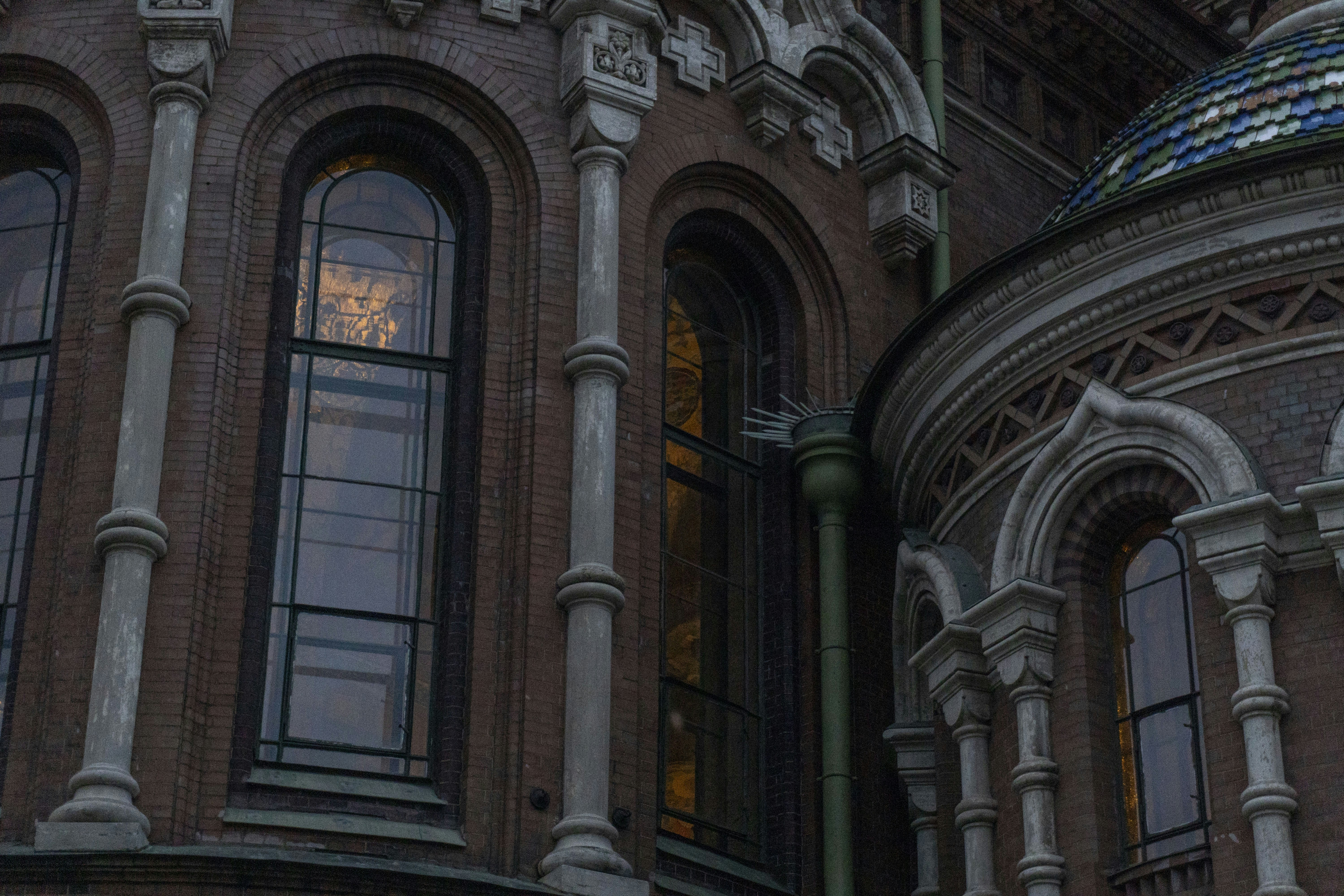 Ornate windows on a brick building facade