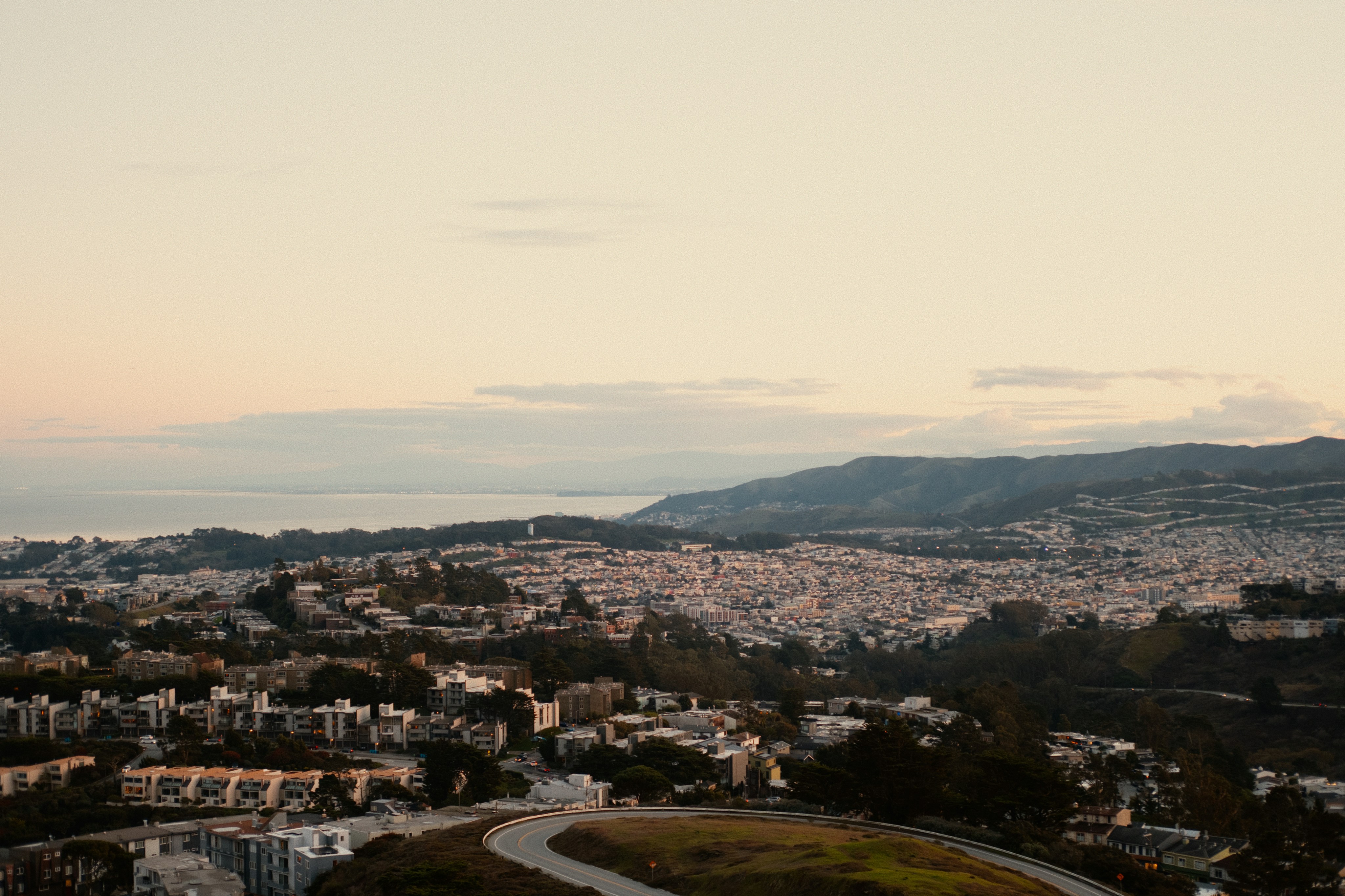 Panoramic view of a sprawling city at dusk.