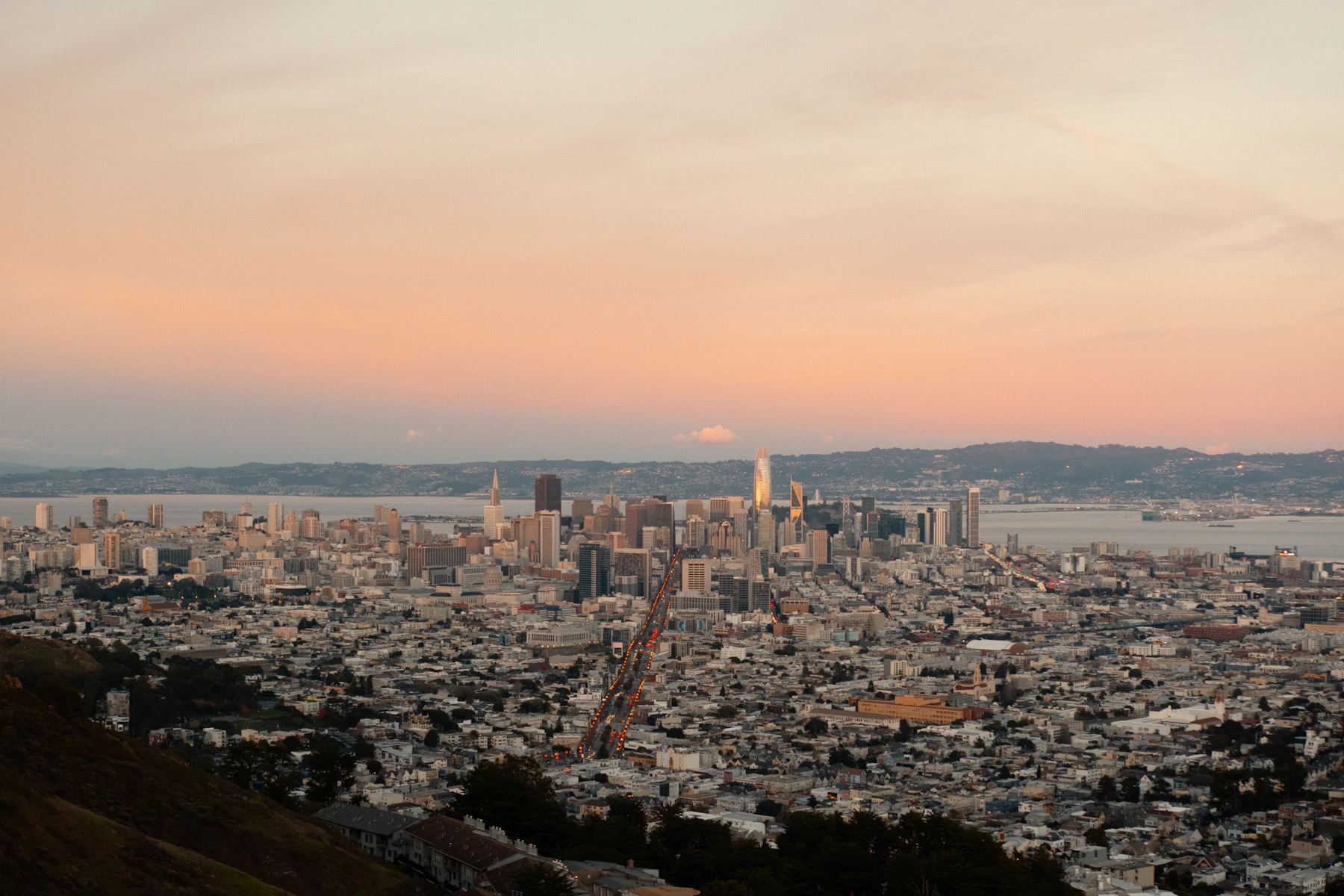 San Francisco skyline at dusk with the bay in the background