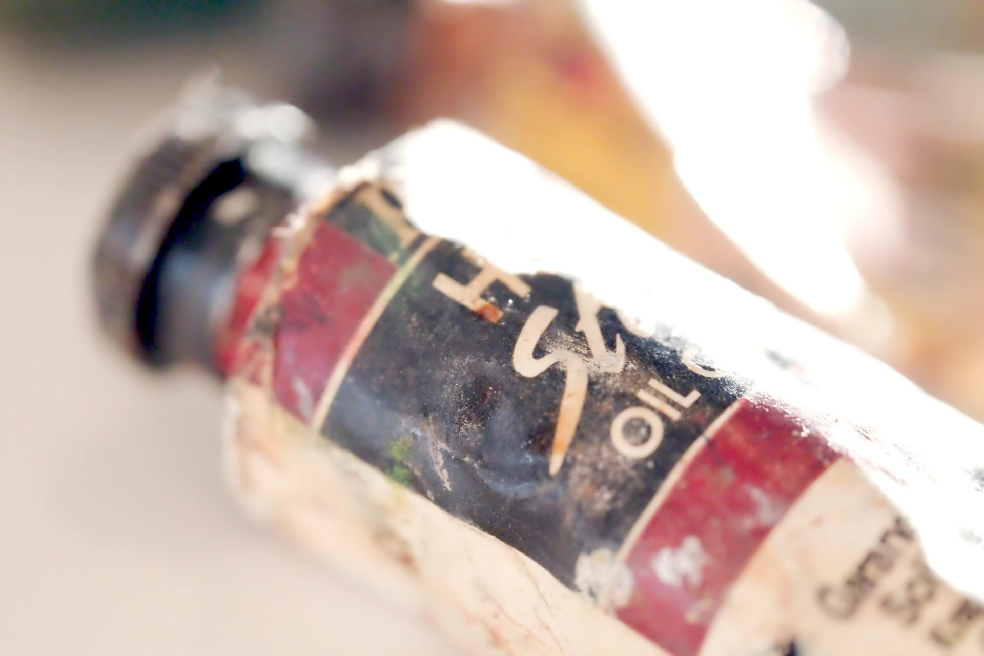 Close-up of a used oil paint tube