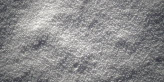 Close-up of coarse gray sand texture