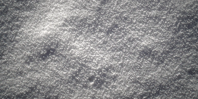 Close-up of coarse gray sand texture