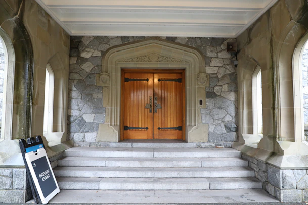Stone building with grand wooden double doors