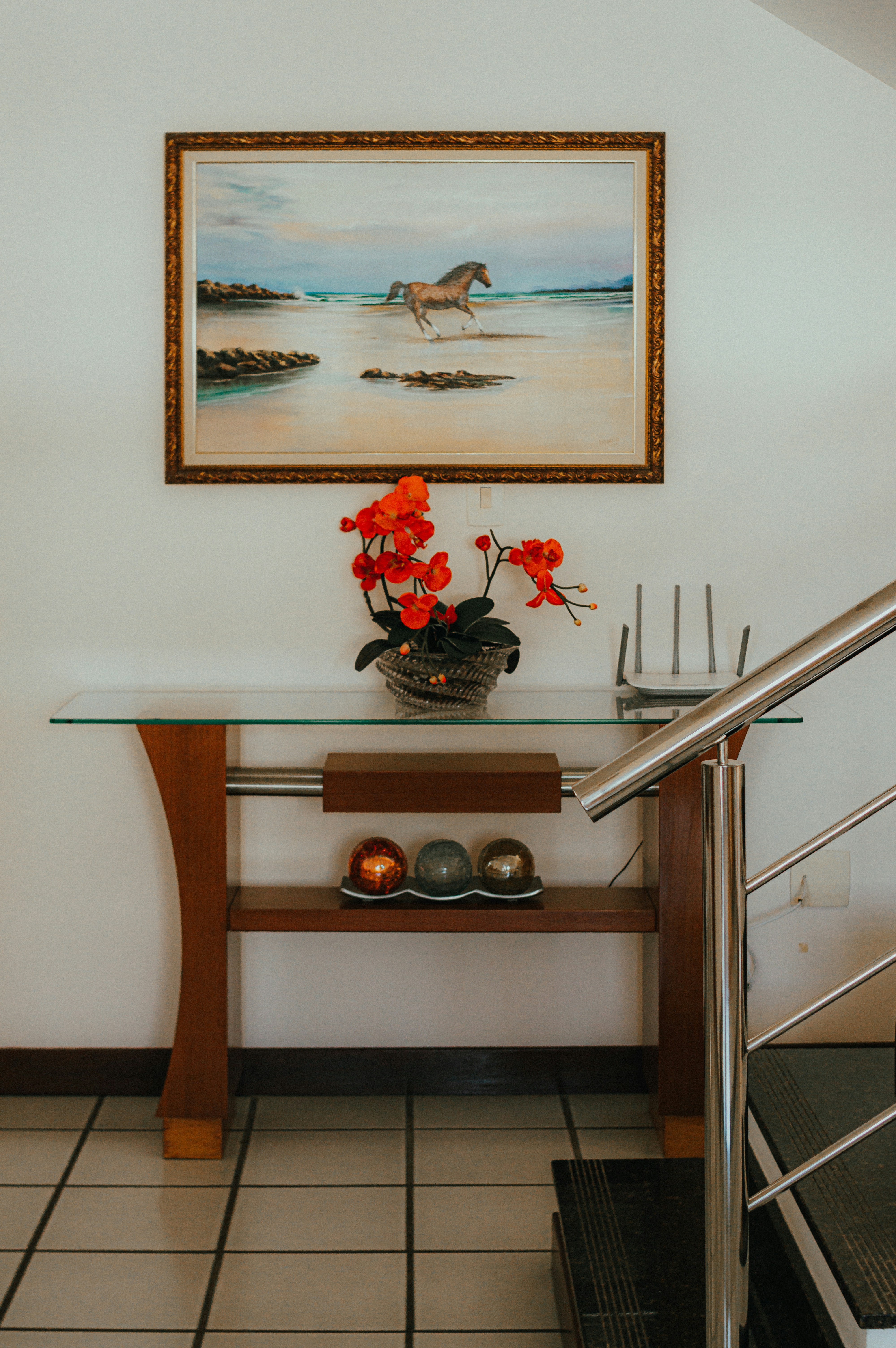 Painting of a horse by a body of water.