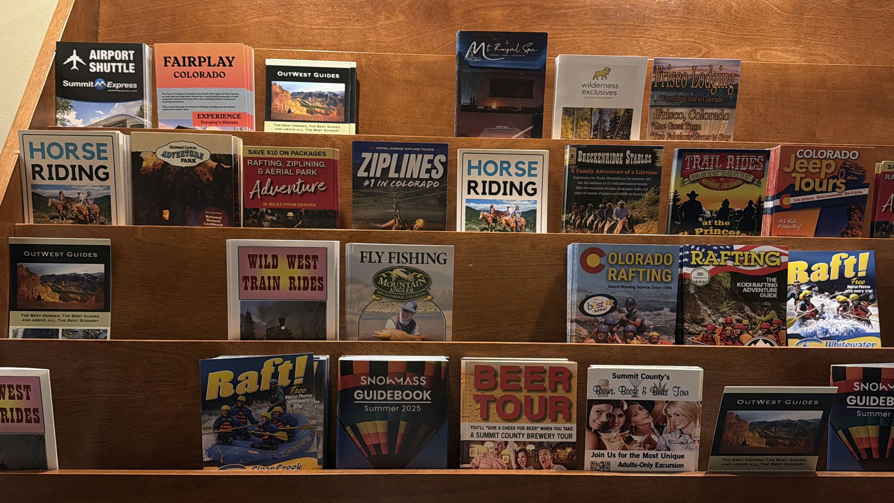 Various travel brochures and books displayed on shelves.