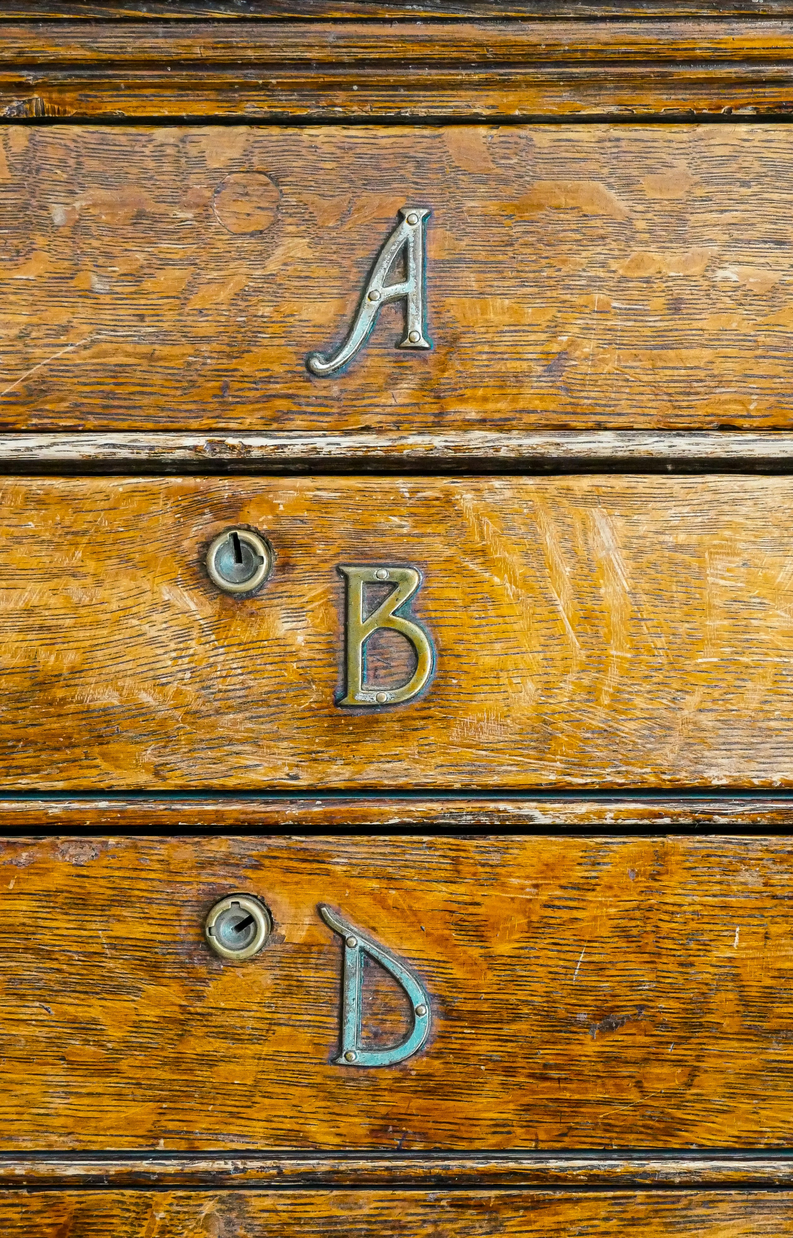 Wooden drawers with letters a, b, and d