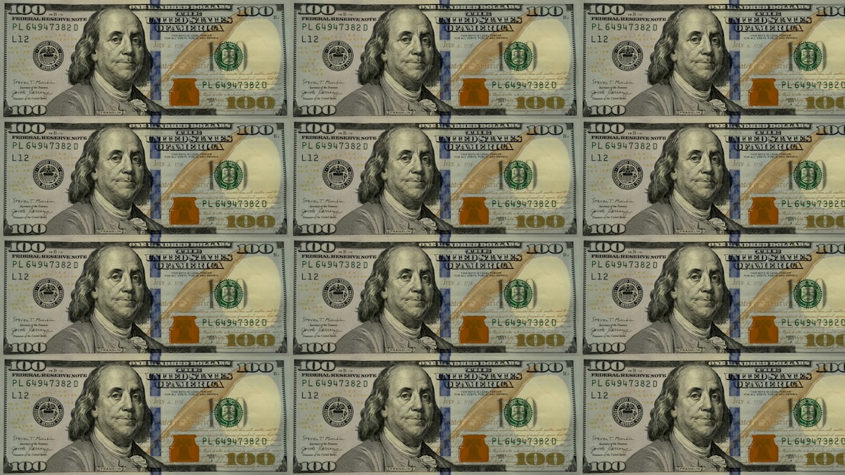 Pattern of United States one hundred dollar bills representing the national debt