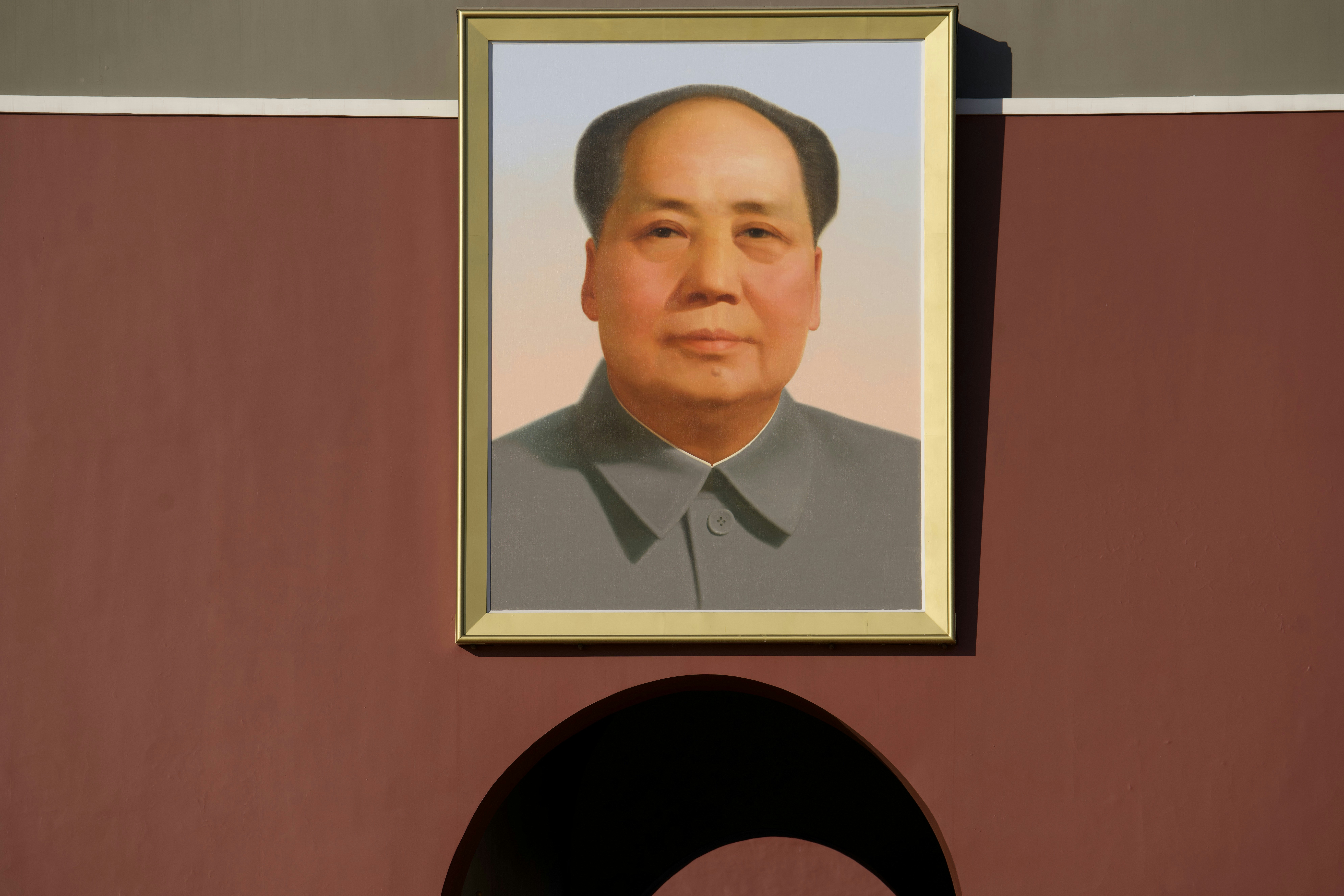 Portrait of mao zedong hanging on a wall.
