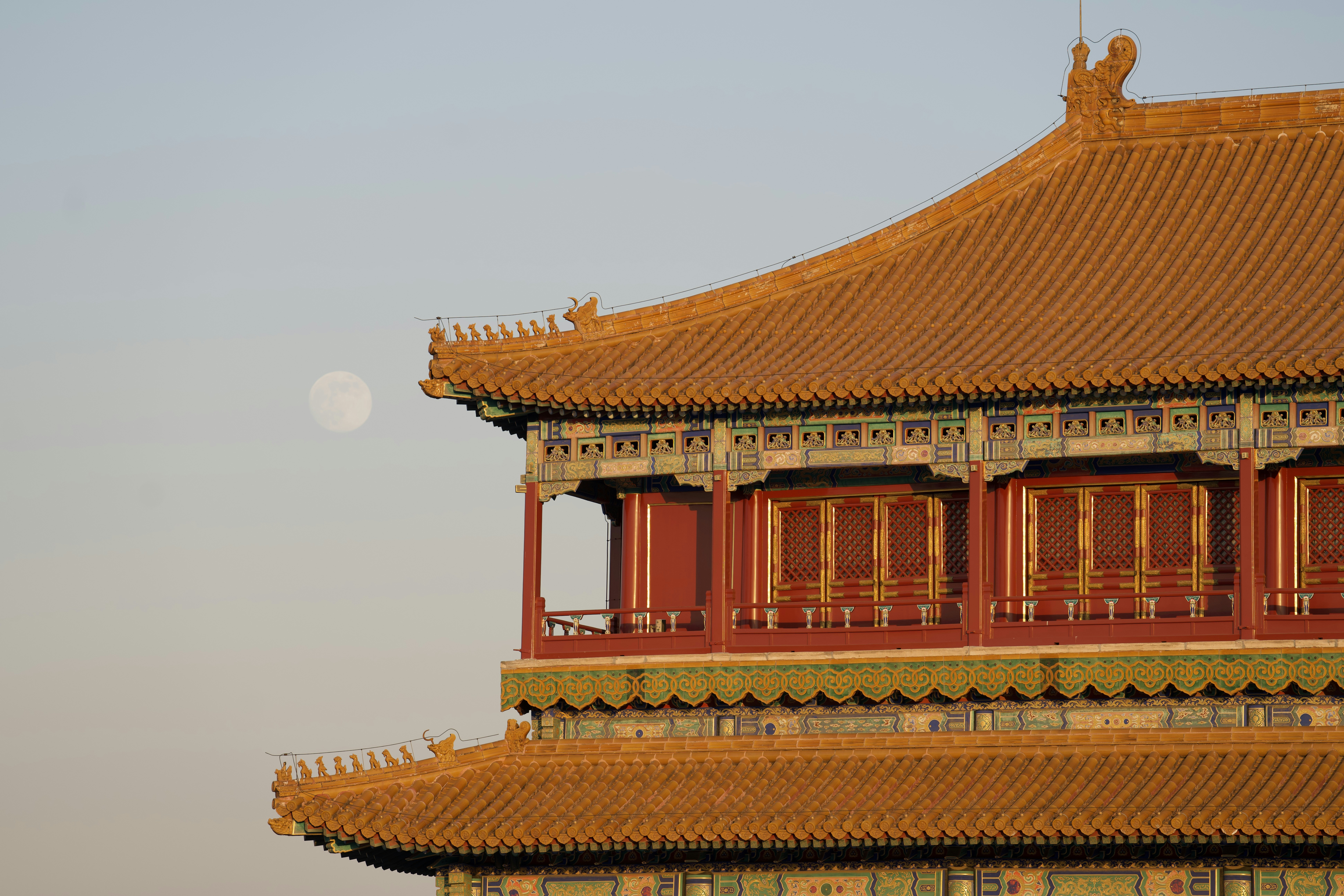 Traditional chinese building with moon in sky