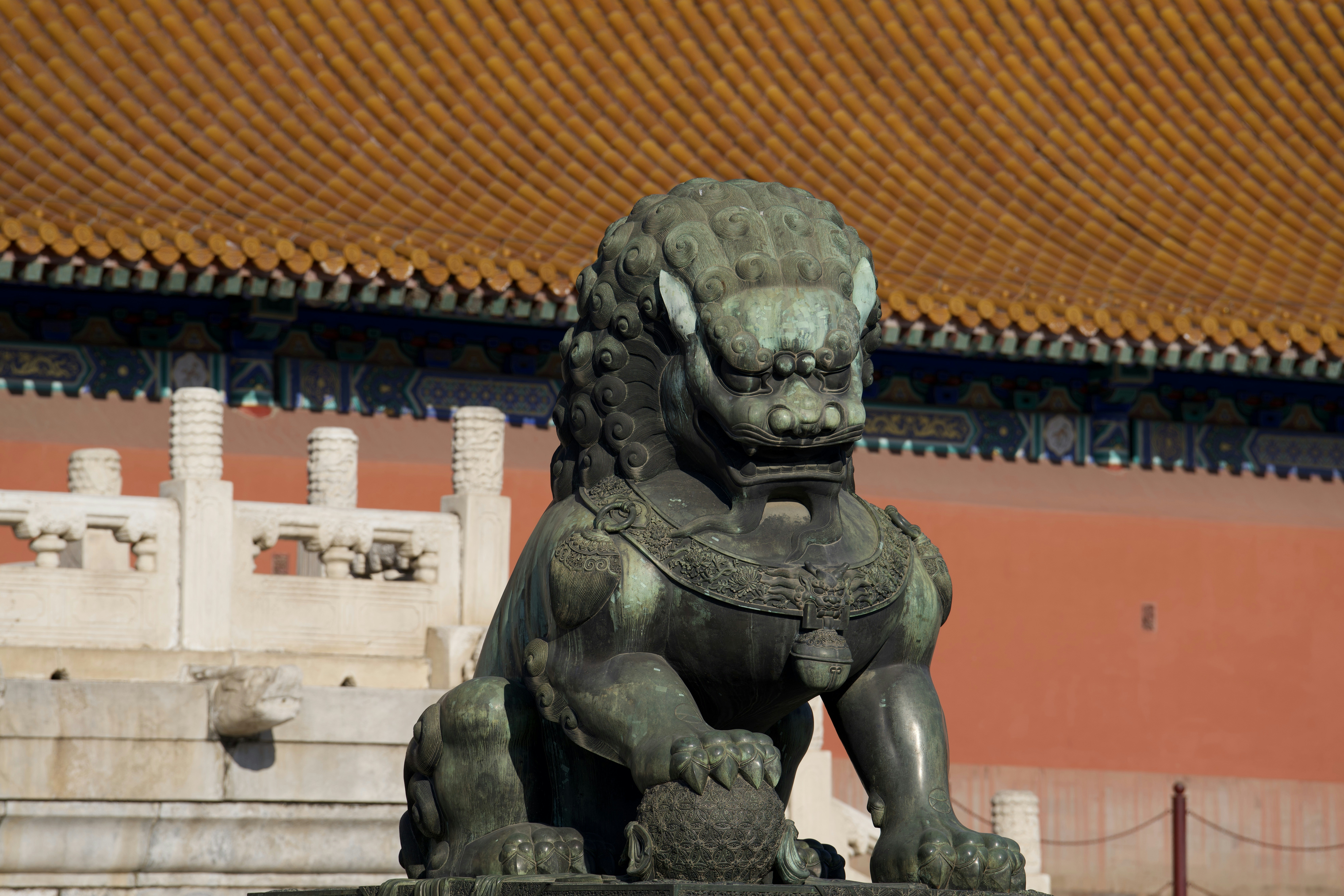 A stone lion statue guards a building entrance