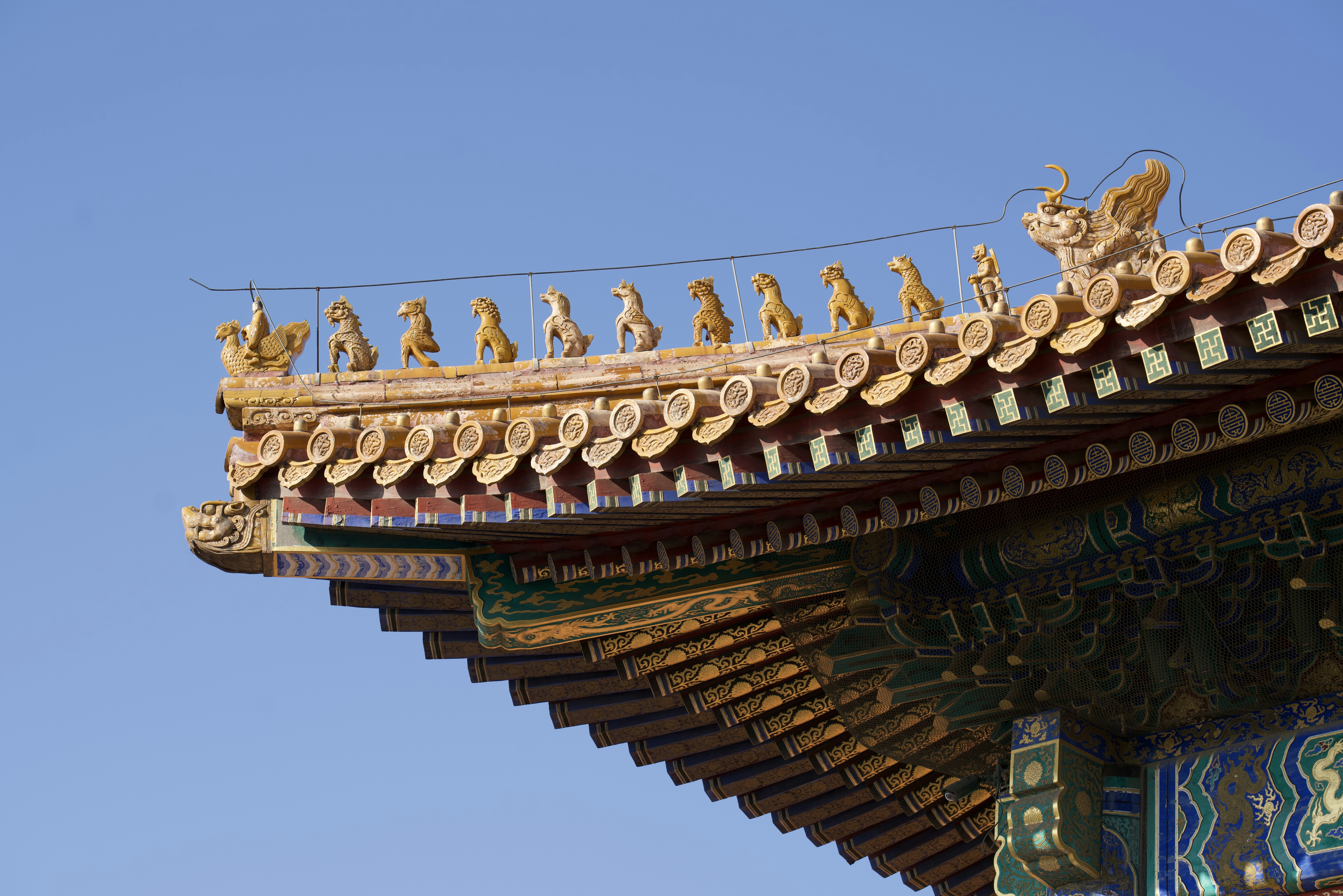 Traditional chinese roof detail against clear blue sky