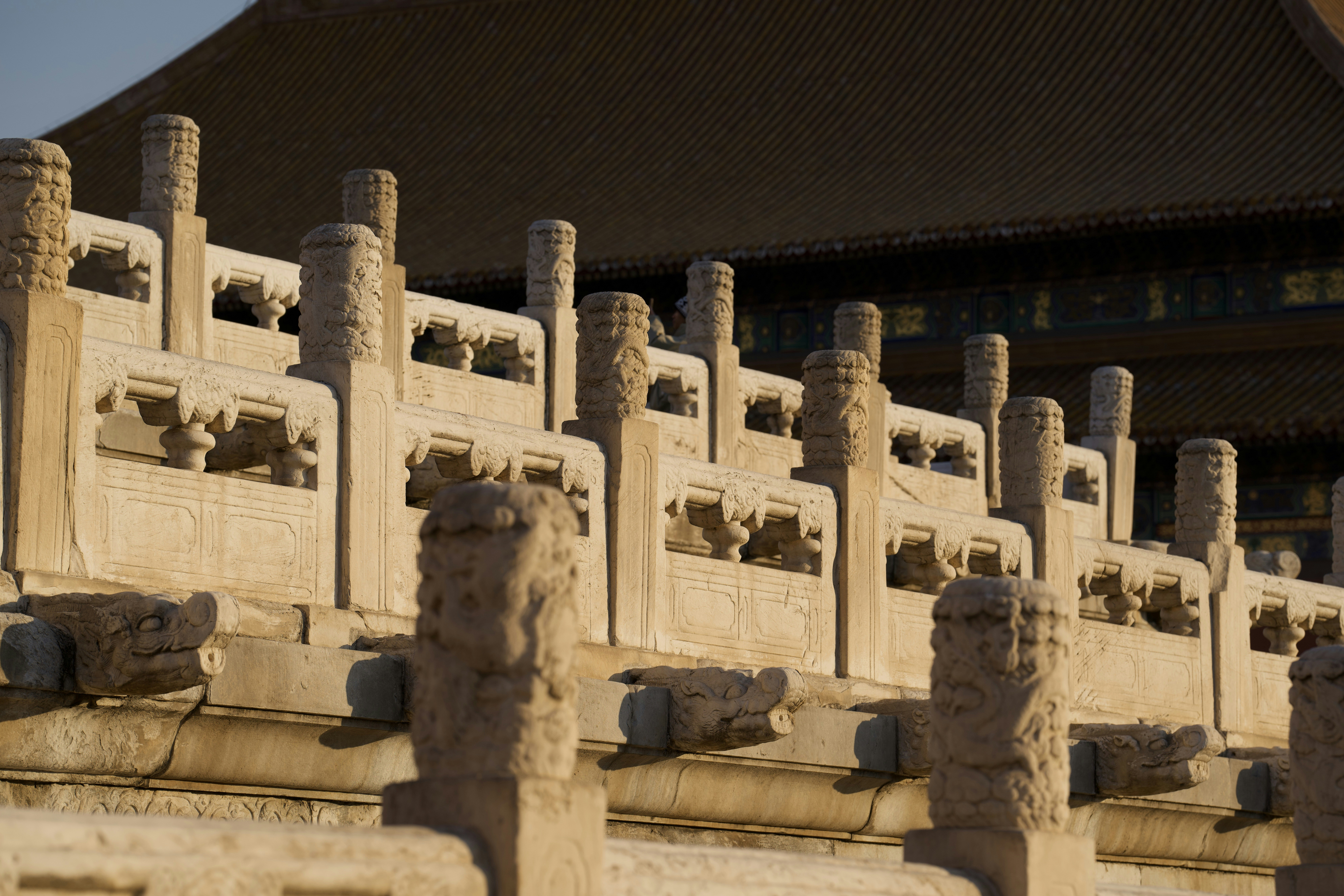 Stone balustrade with ornate carvings at ancient palace