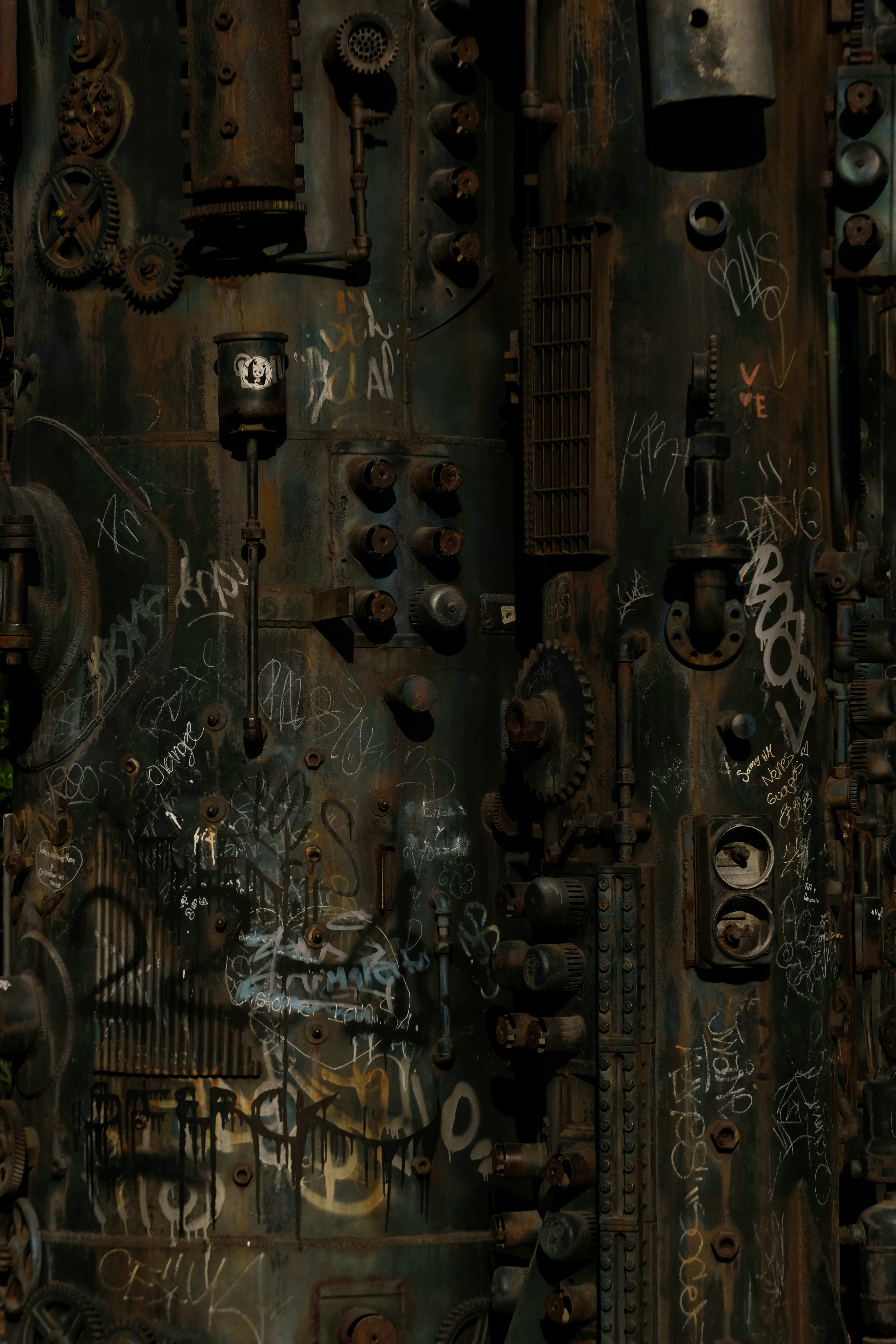 Graffiti on rusty industrial machinery