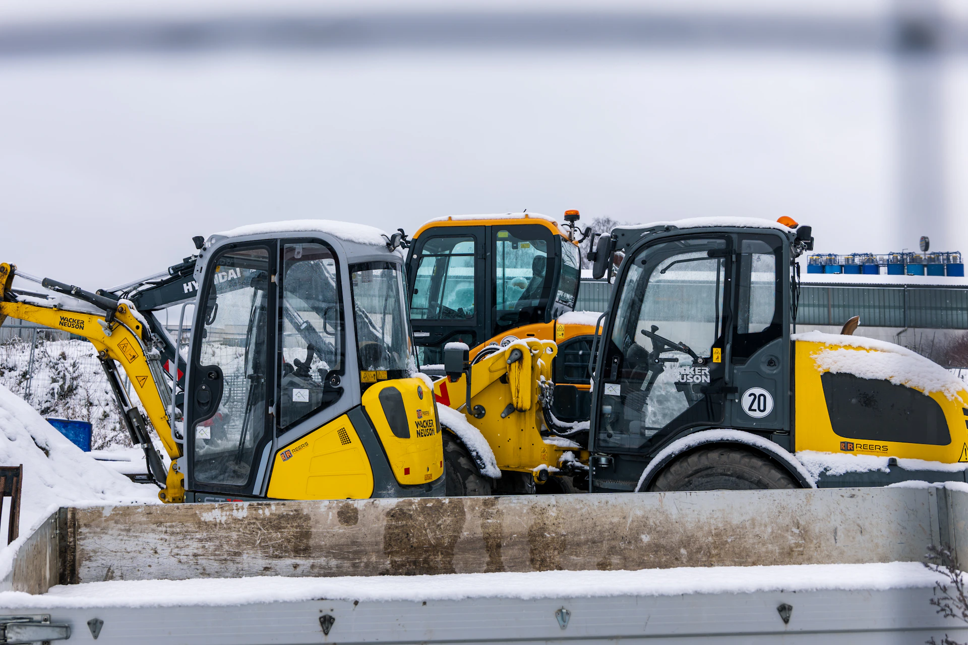 Construction vehicles parked in the snow