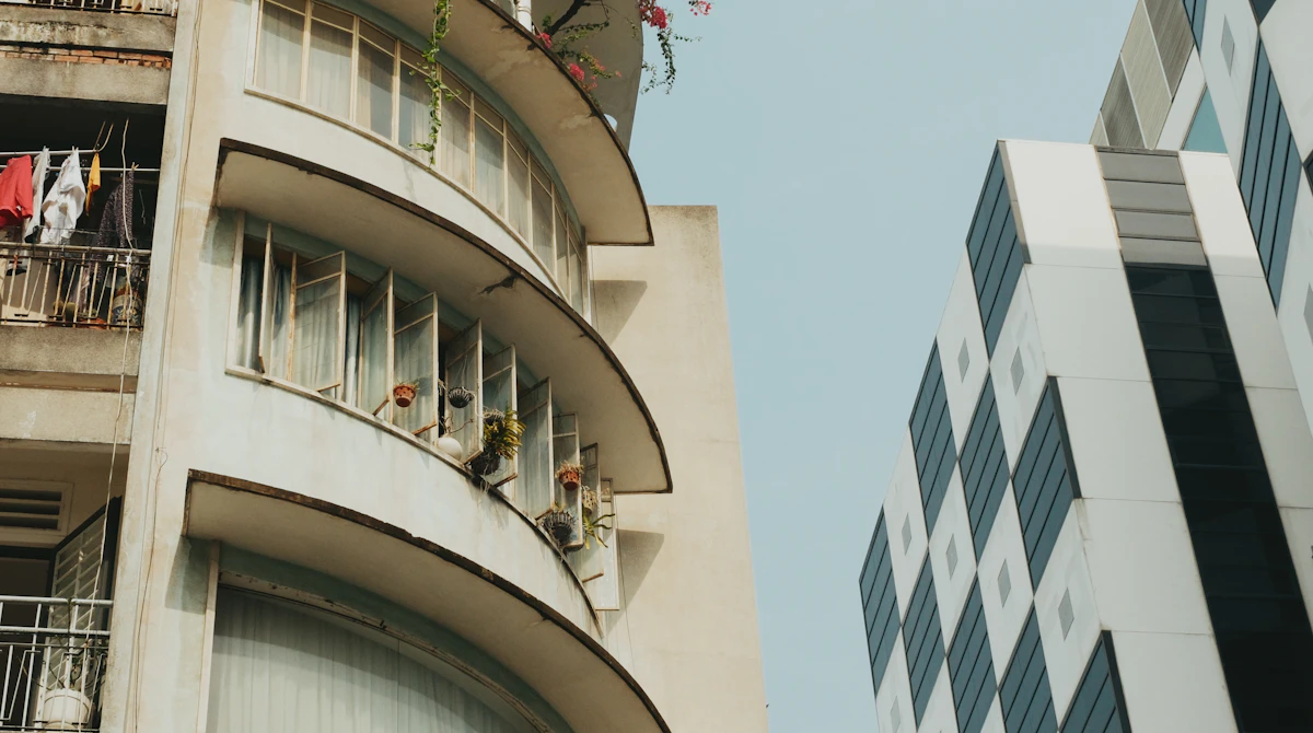 Apartment building exterior in Ho Chi Minh District 1 showing rental price range