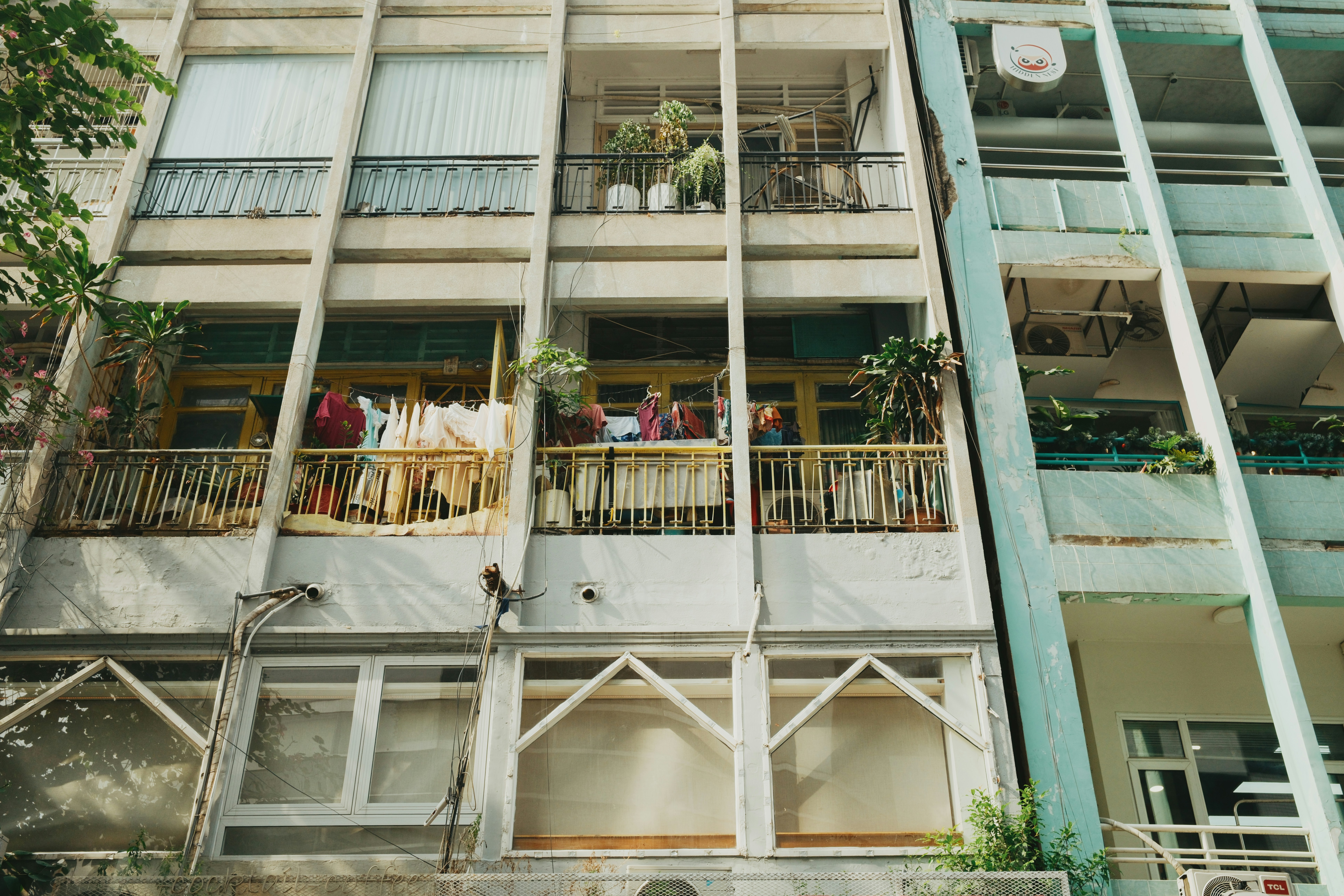 Apartment balconies with clothes hanging to dry.