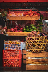 Fresh fruits and vegetables displayed in wooden crates.