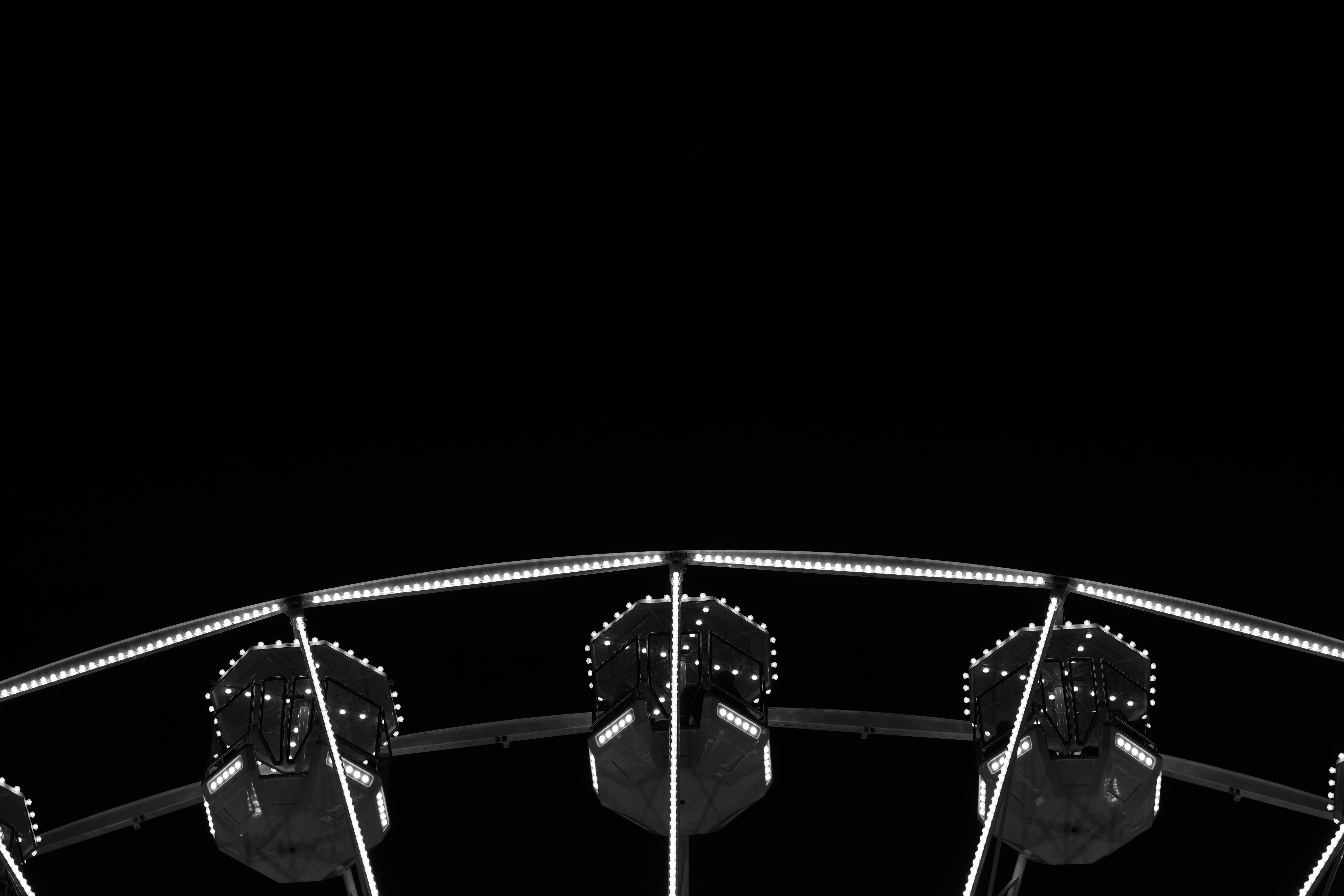 Ferris wheel cabins against a dark sky