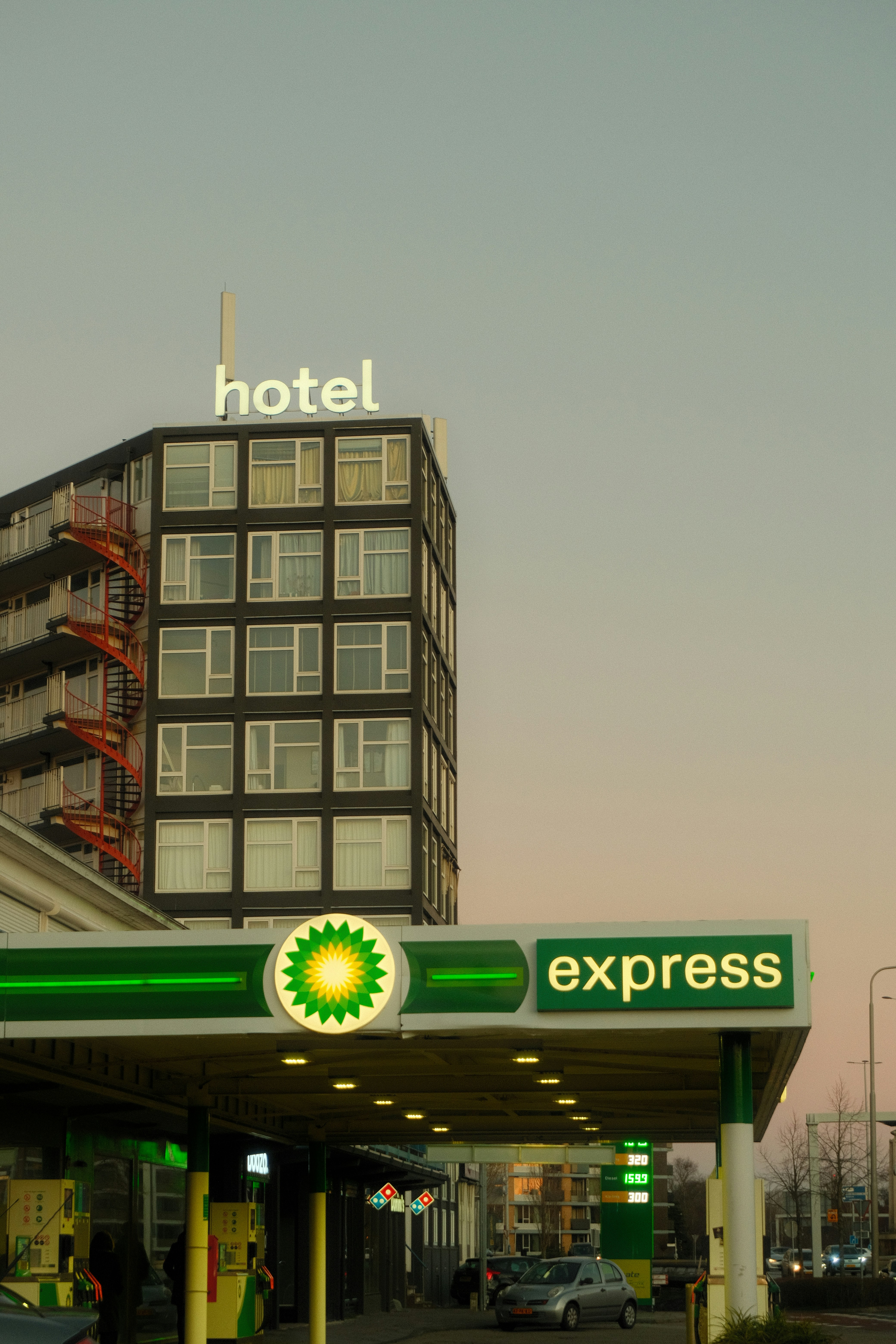 Hotel sign above bp express gas station