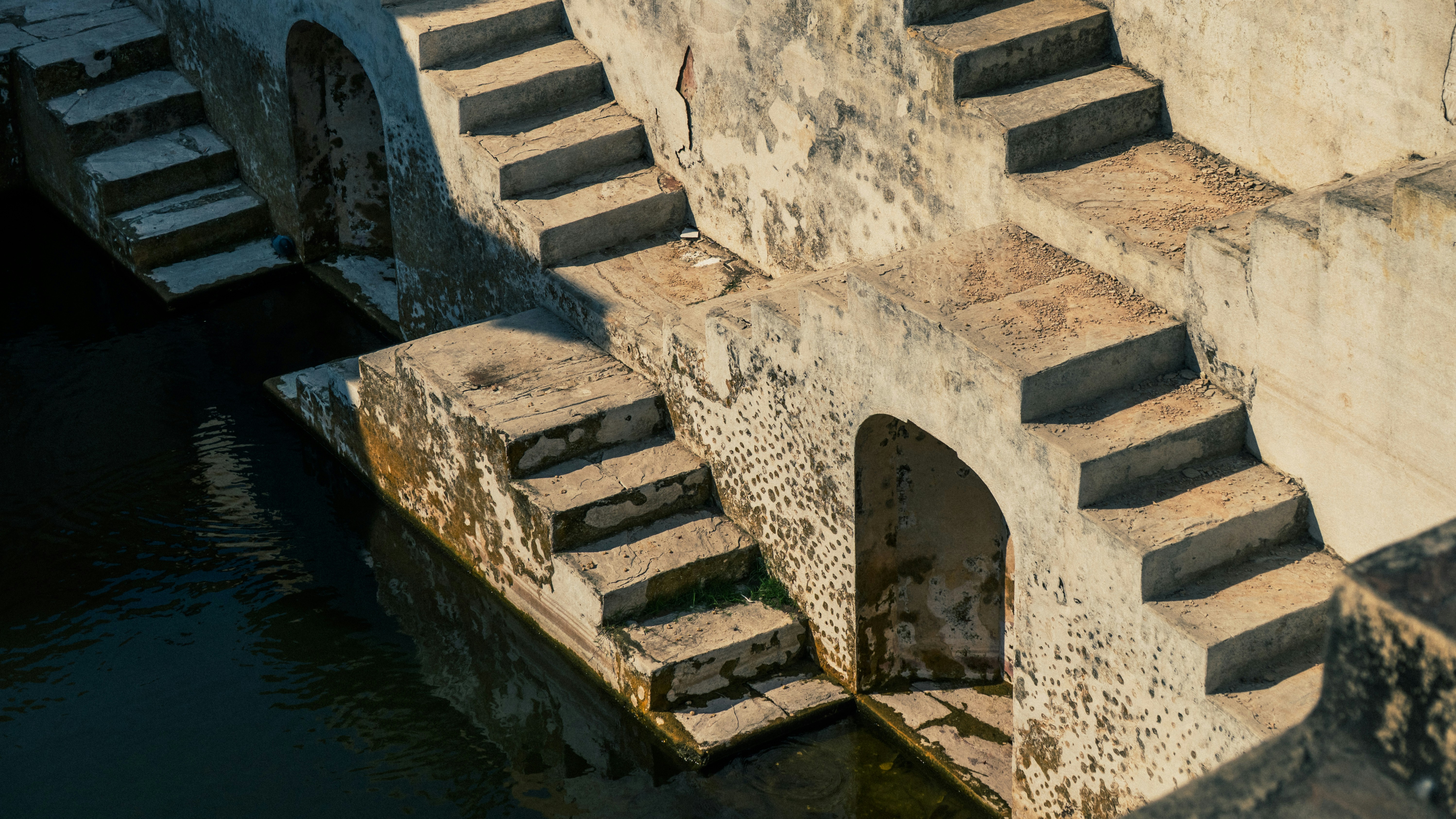 Stone steps leading down to dark water