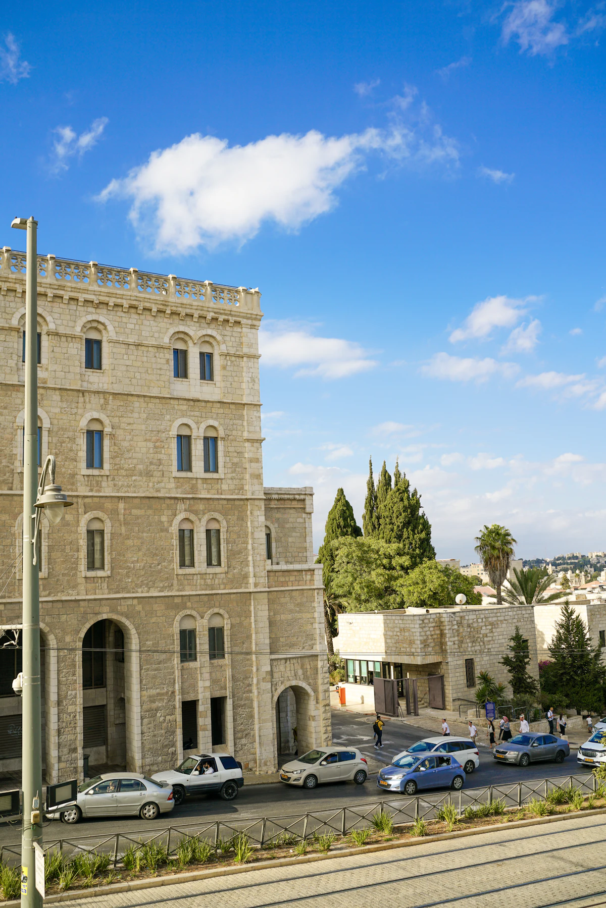 A stone apartment building on a Jerusalem residential street