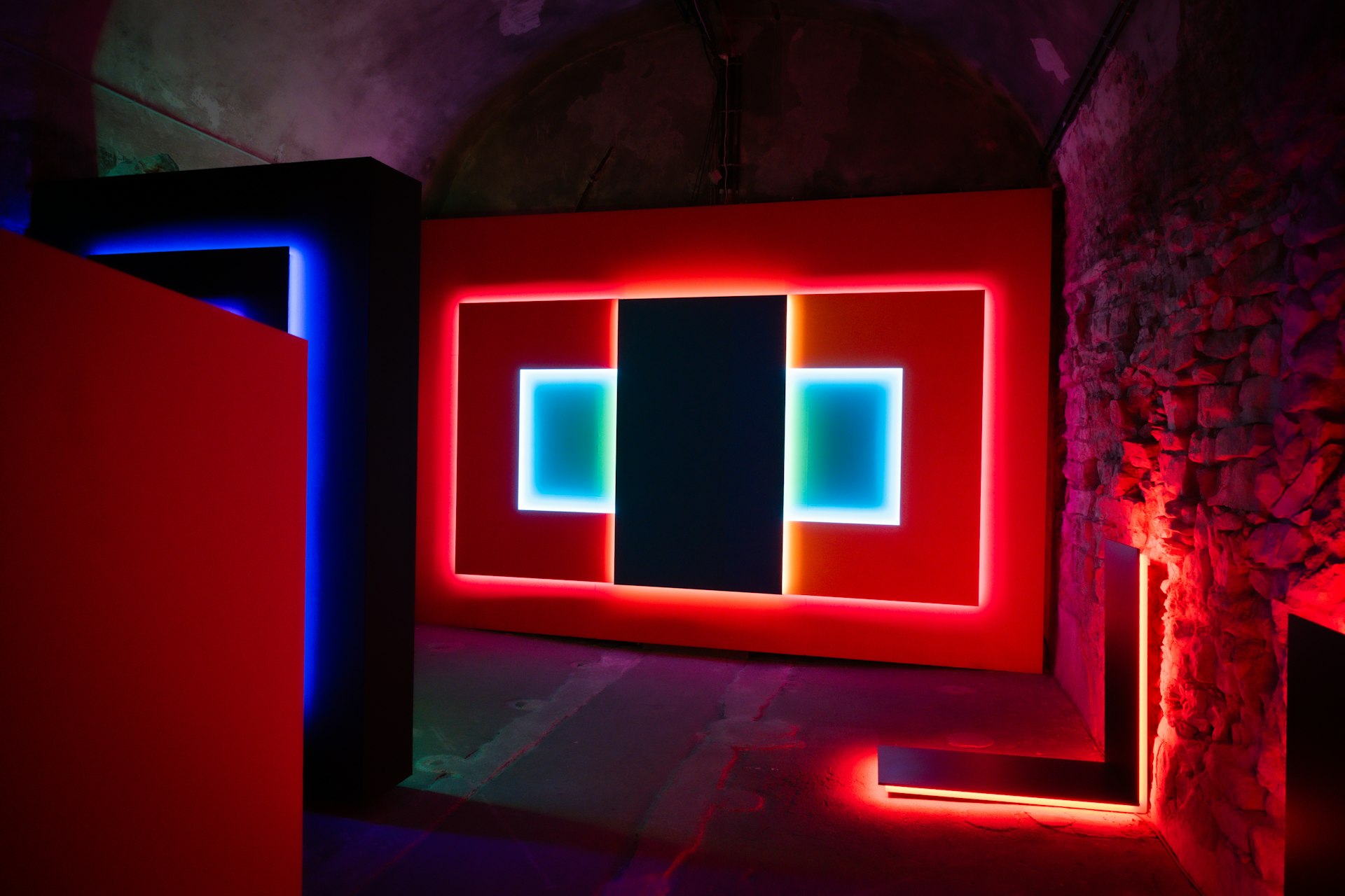 Modern art installation with red and blue neon lights