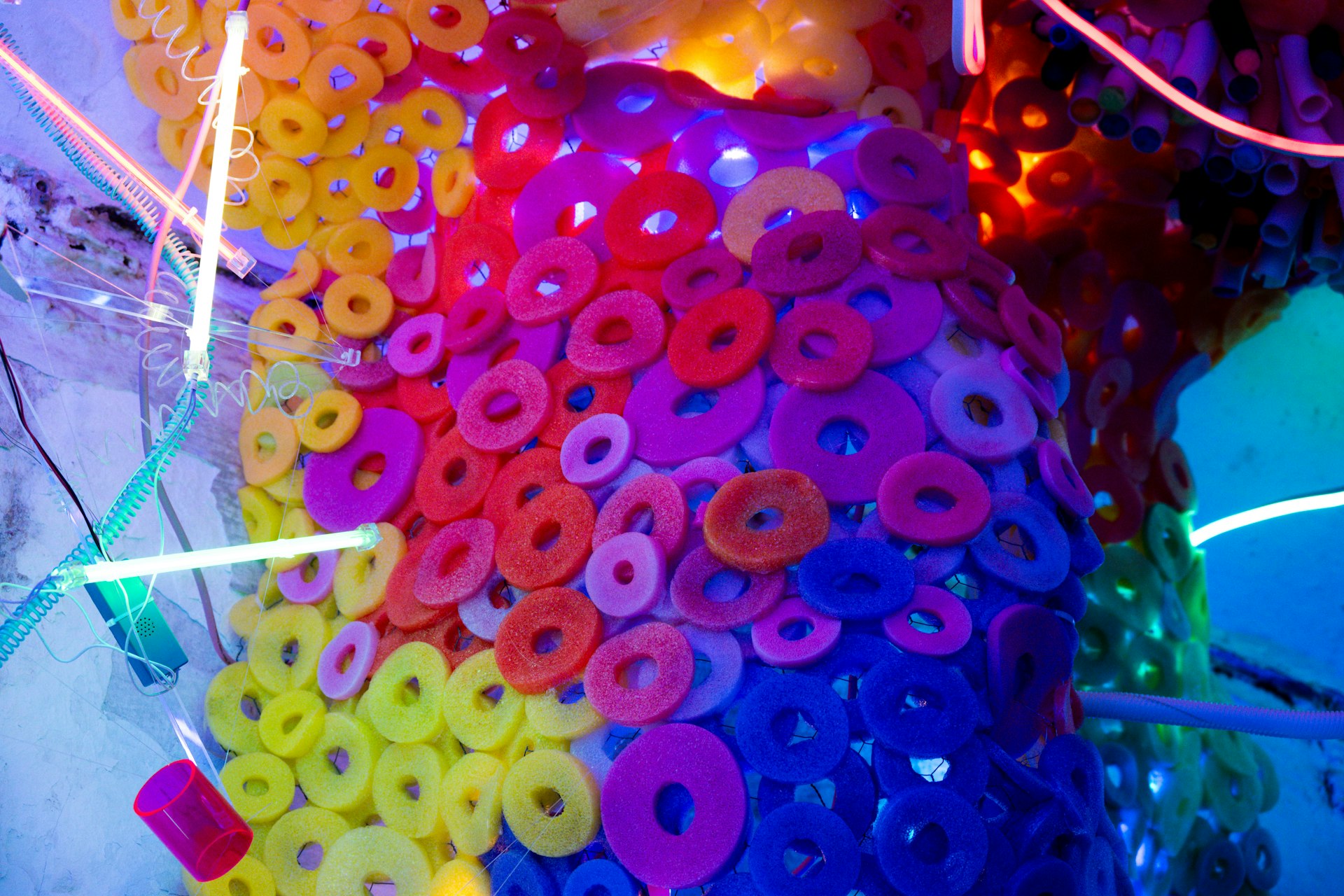 Abstract art installation with colorful rings and lights