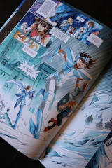 Comic book panel with anime characters in battle.