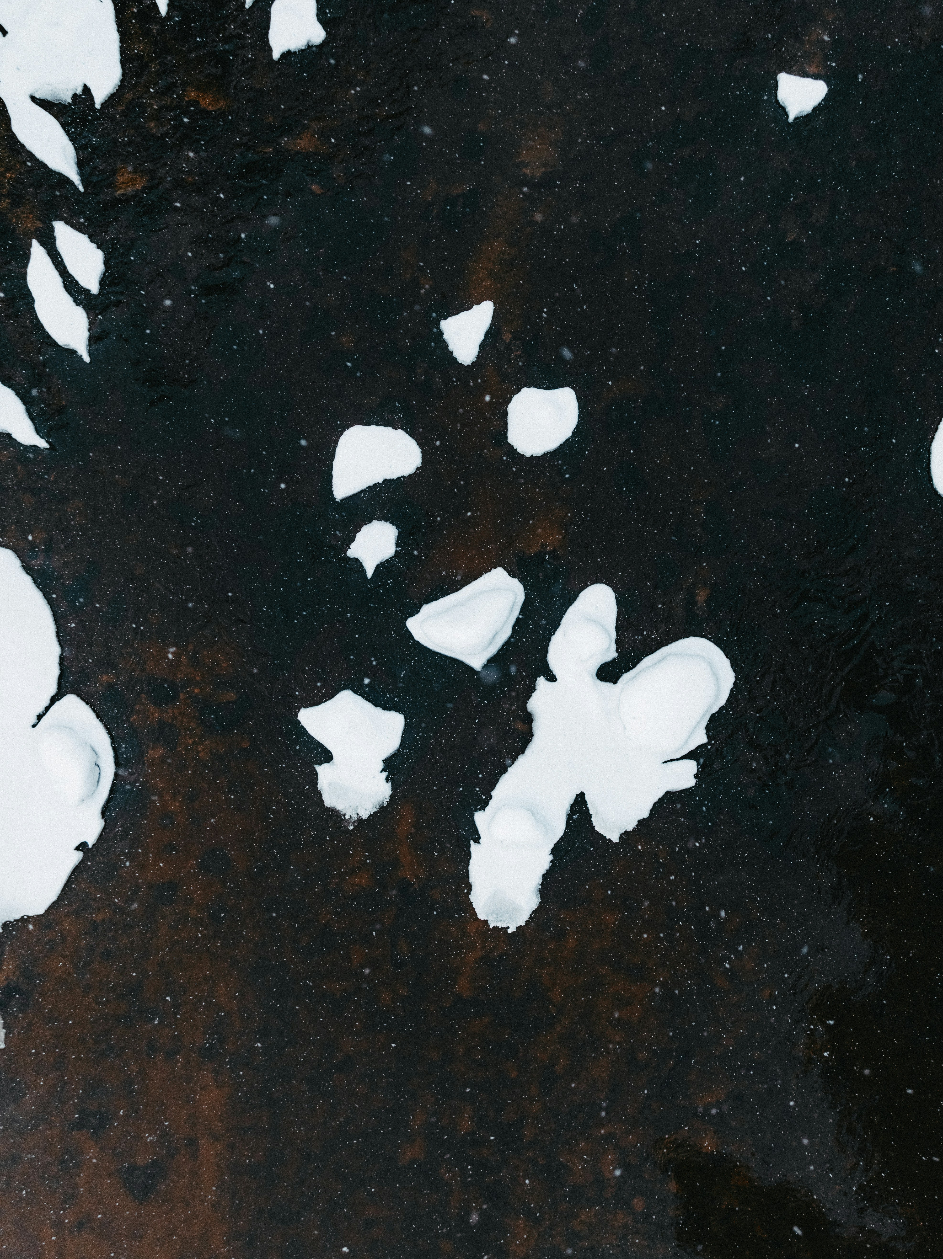 Abstract pattern of white shapes on dark background