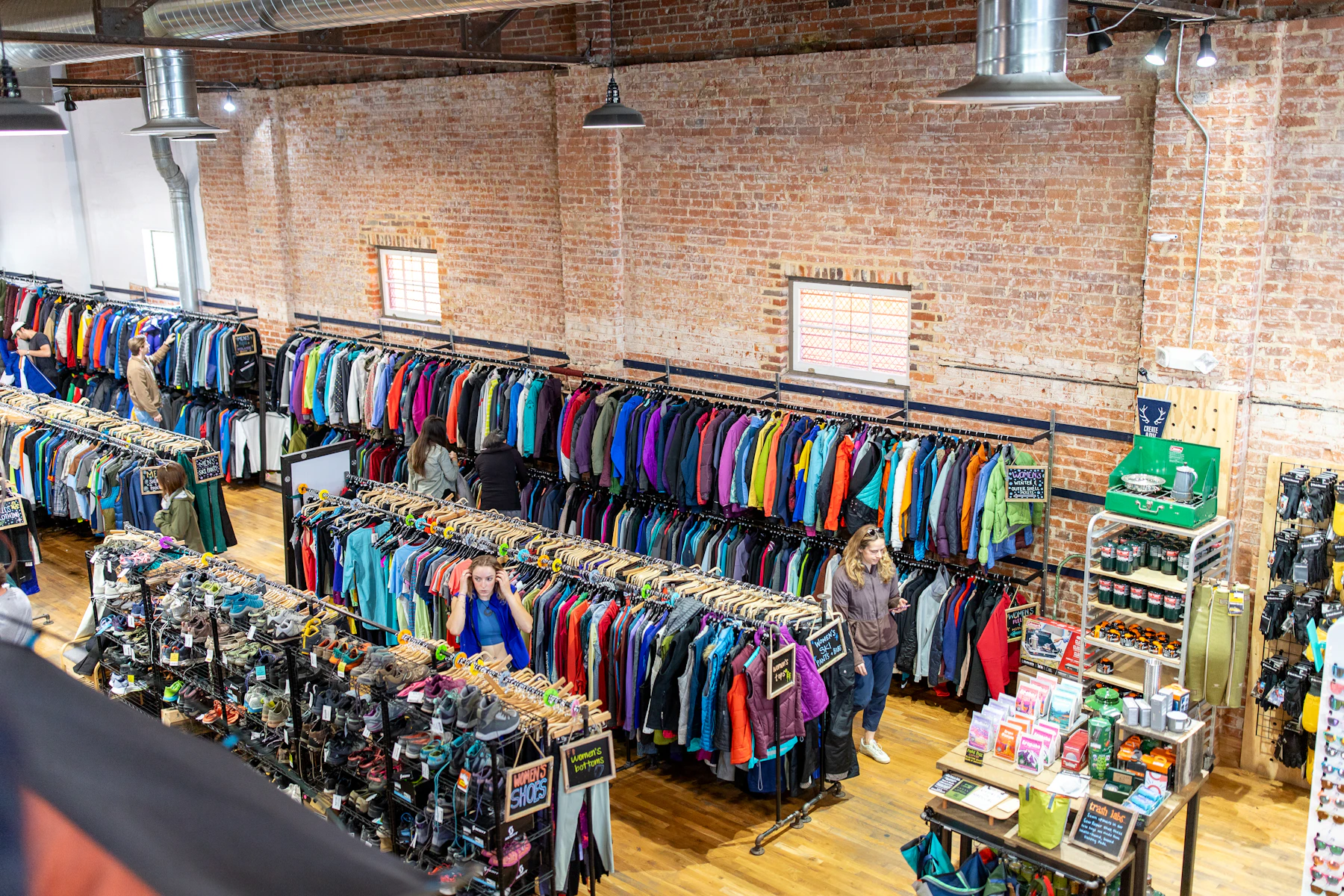 Retail store interior with racks of colorful clothing